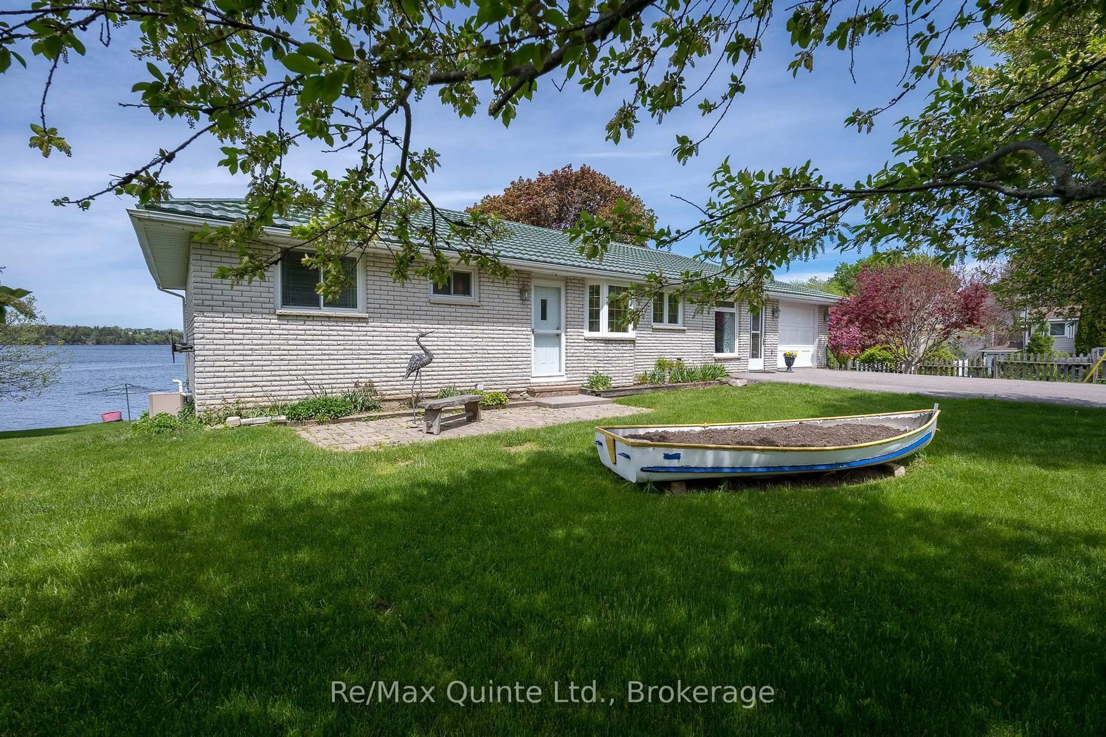 A pic from outside/outdoor area/front of a property/back of a property/a pic from drone, water/lake/river/ocean view for 54 Cedar Lane, Prince Edward County Ontario K0K 2T0