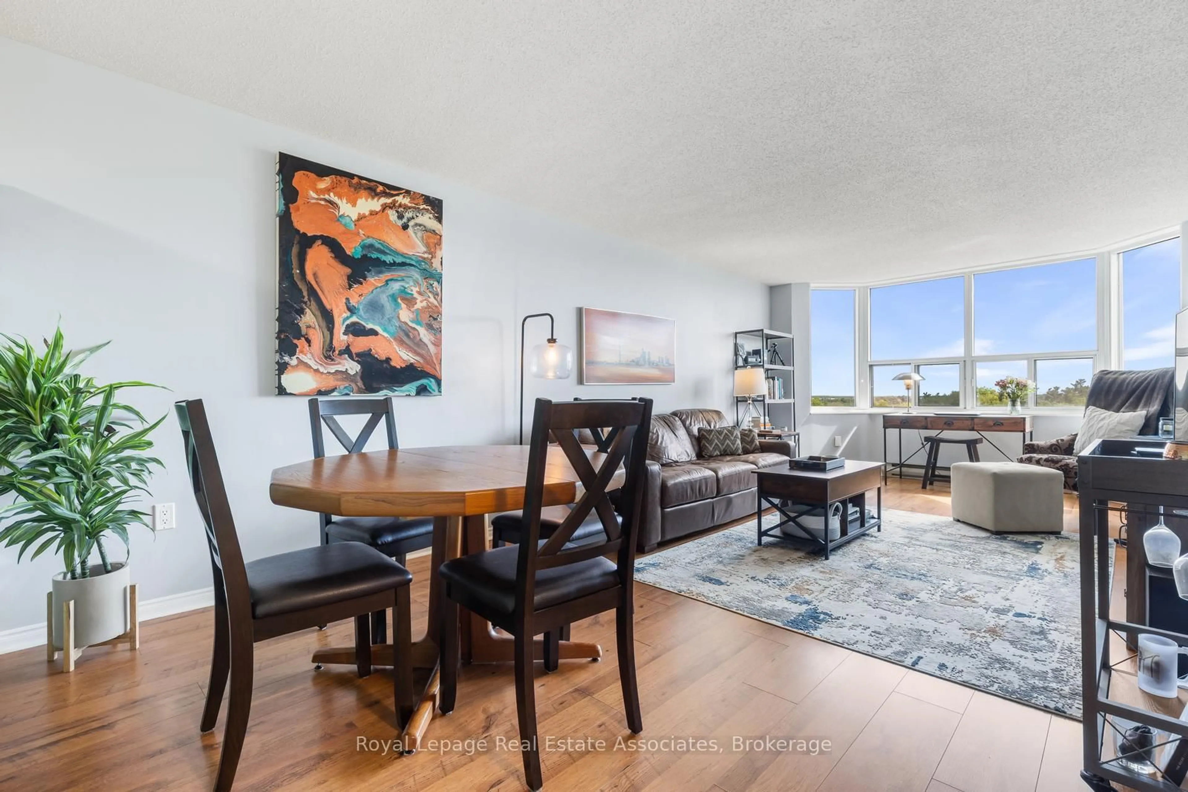 Living room with furniture, wood/laminate floor for 55 Green Valley Dr #1502, Kitchener Ontario N2P 1Z6