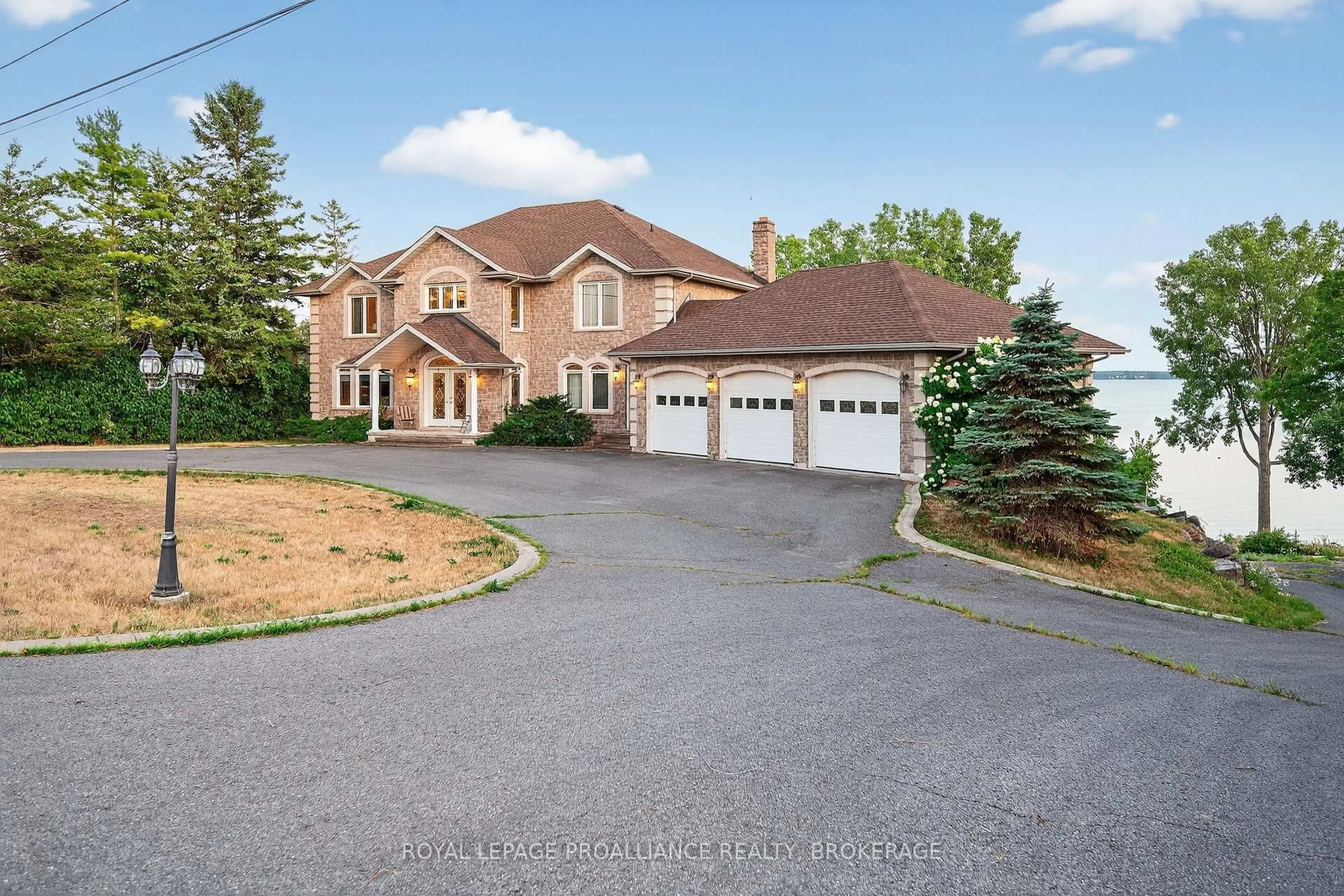A pic from outside/outdoor area/front of a property/back of a property/a pic from drone, street for 4734 Lakeside Lane, Bath Ontario K0H 1G0