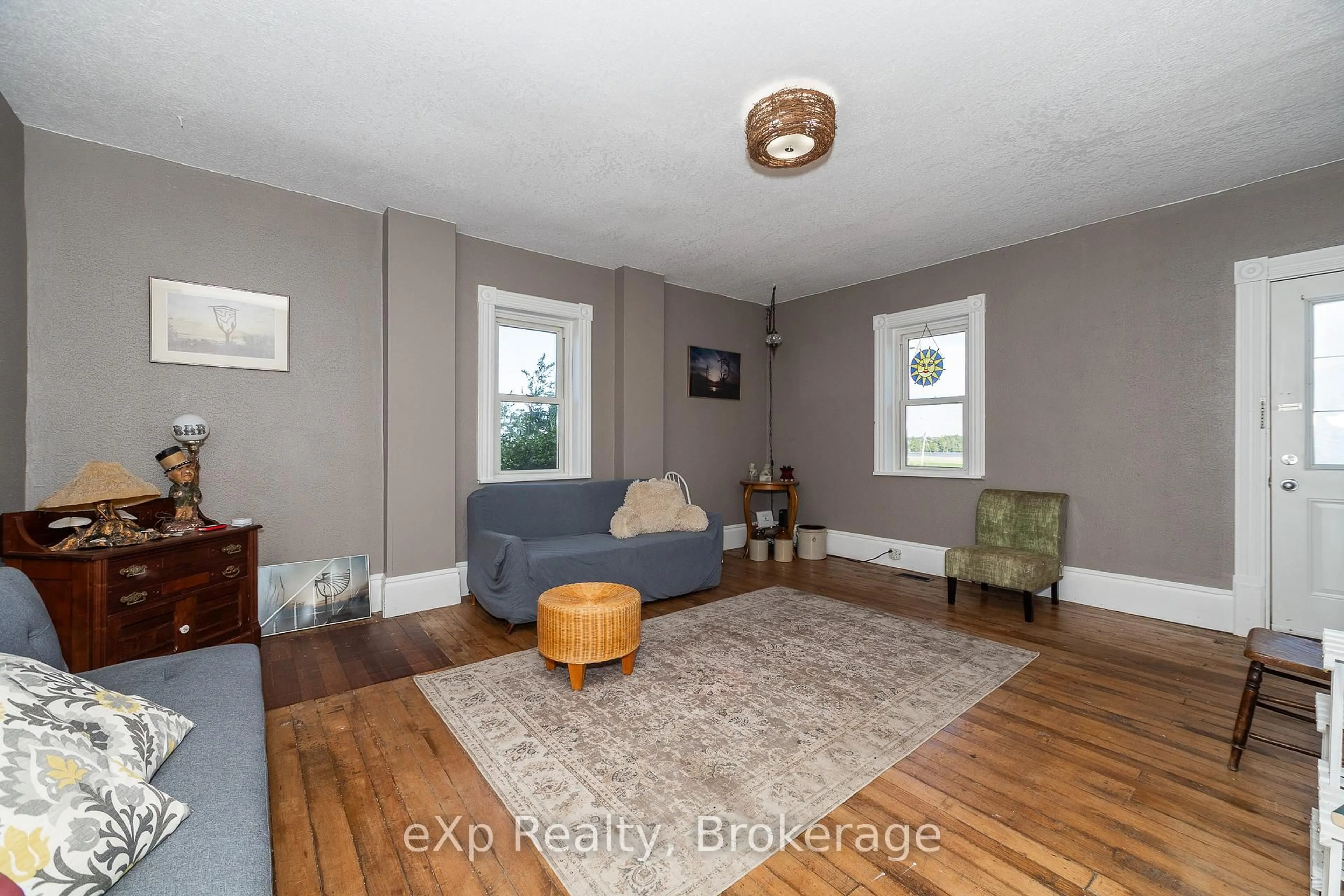 Living room with furniture, wood/laminate floor for 1097 6 Highway, South Bruce Peninsula Ontario N0H 1X0