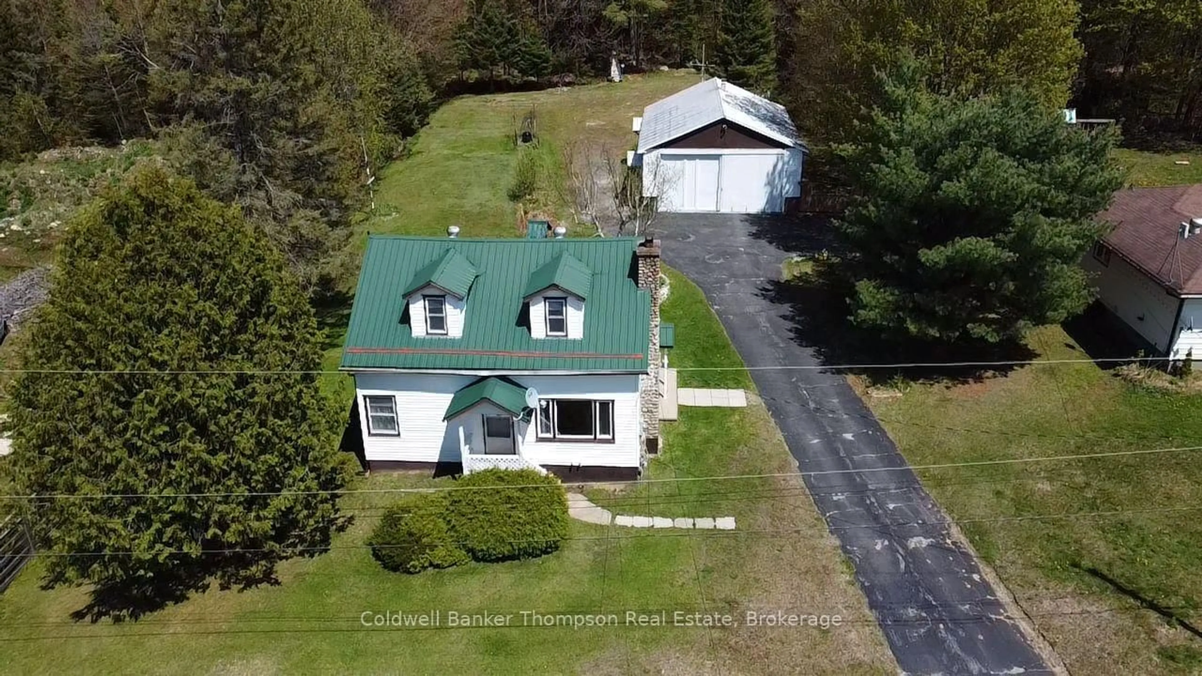A pic from outside/outdoor area/front of a property/back of a property/a pic from drone, street for 37 Eagle Lake Rd, South River Ontario P0A 1X0