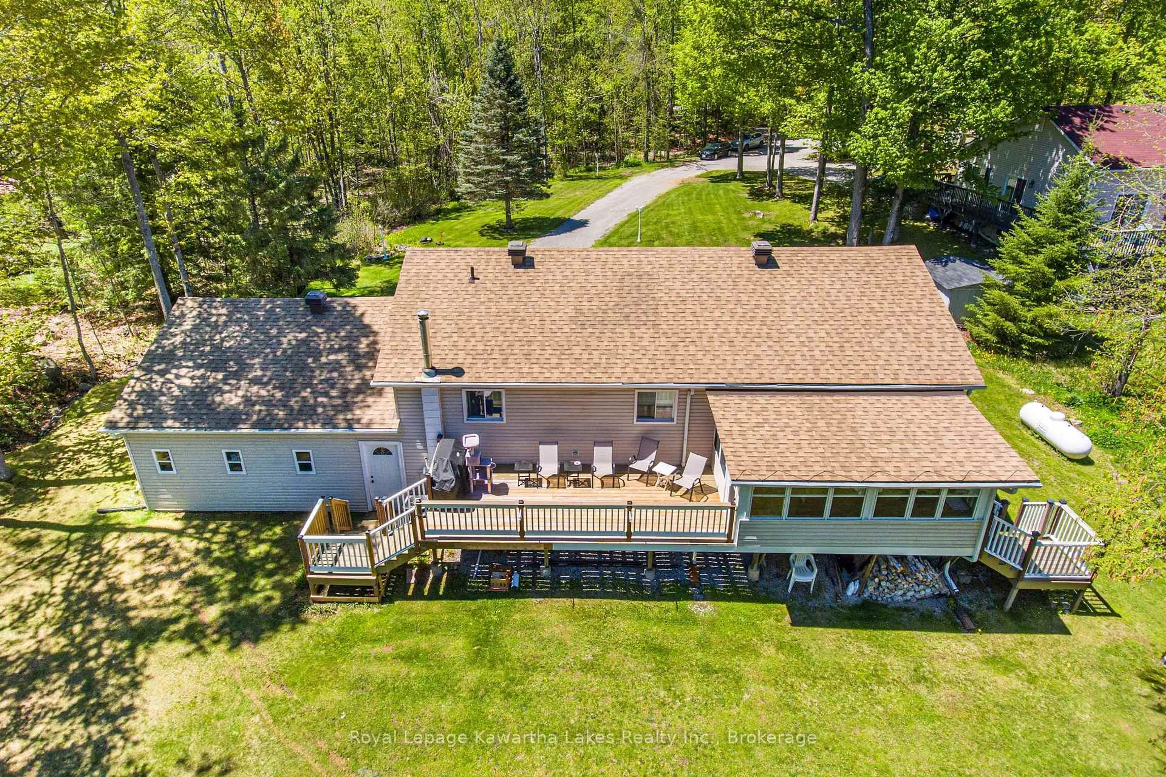 A pic from outside/outdoor area/front of a property/back of a property/a pic from drone, water/lake/river/ocean view for 17 Fire Rte, Trent Lakes Ontario K0M 1A0