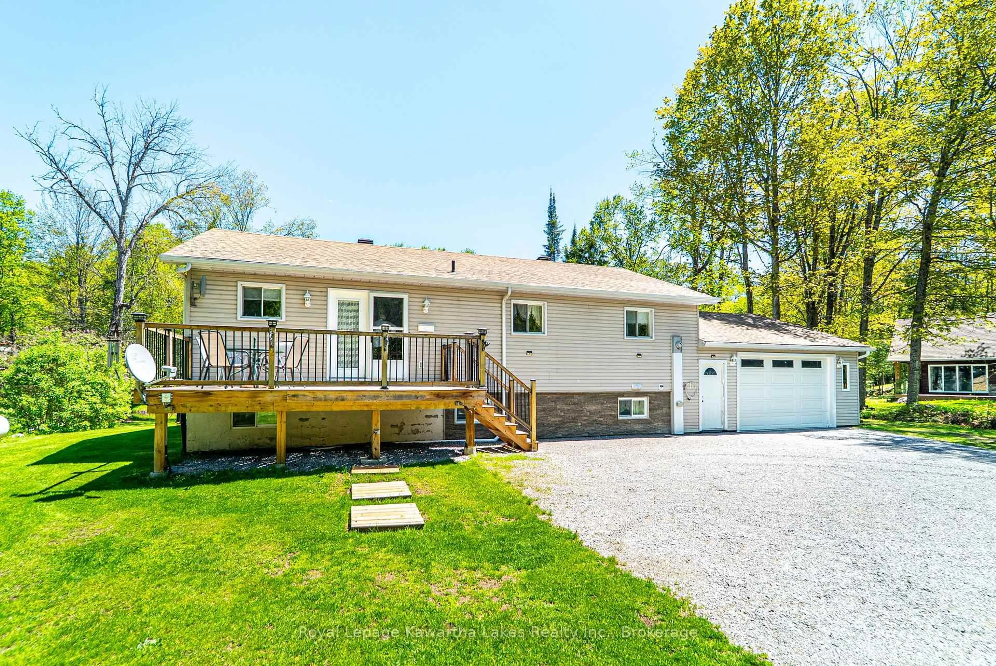 Home with vinyl exterior material, street for 17 Fire Rte, Trent Lakes Ontario K0M 1A0