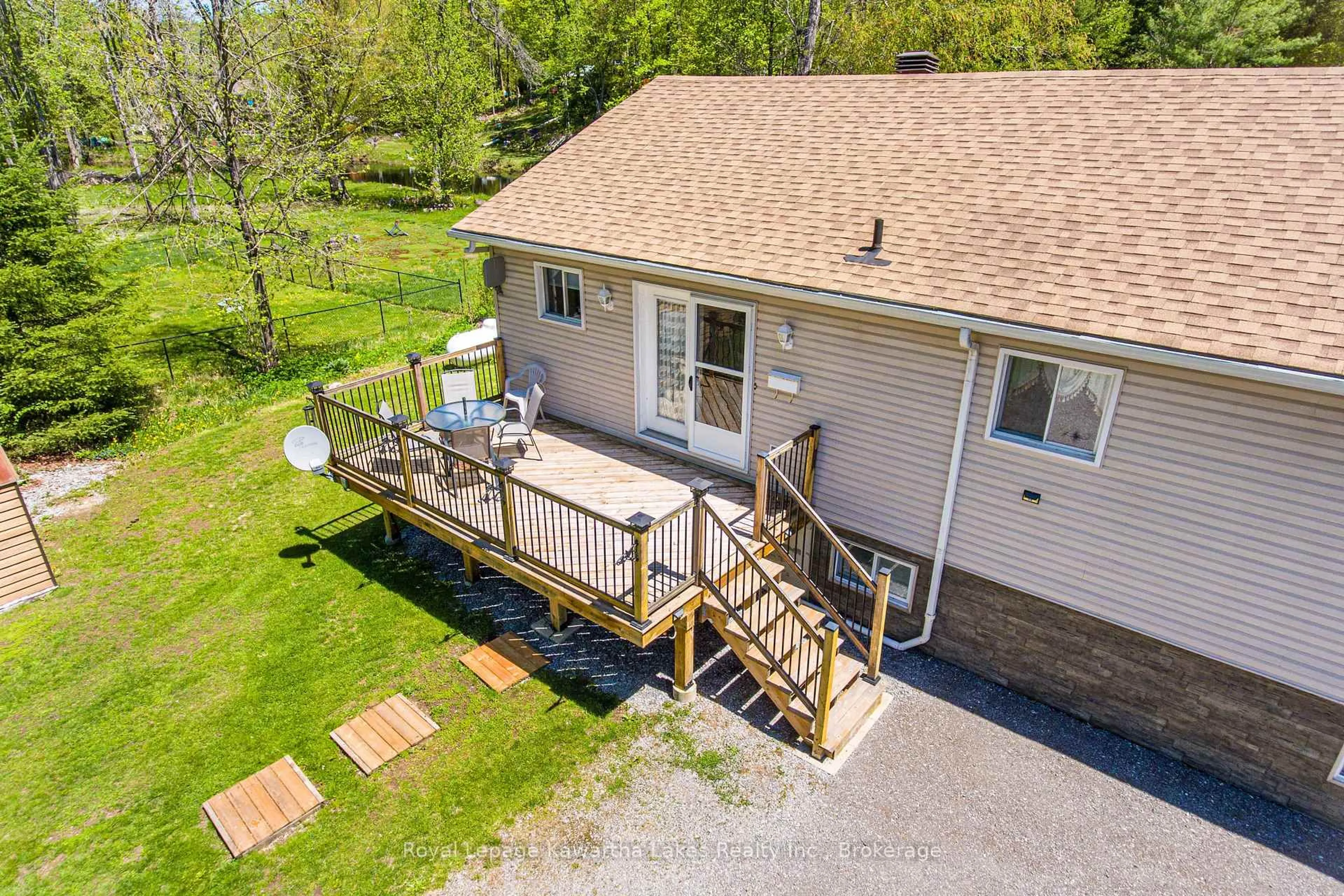 A pic from outside/outdoor area/front of a property/back of a property/a pic from drone, water/lake/river/ocean view for 17 Fire Rte, Trent Lakes Ontario K0M 1A0