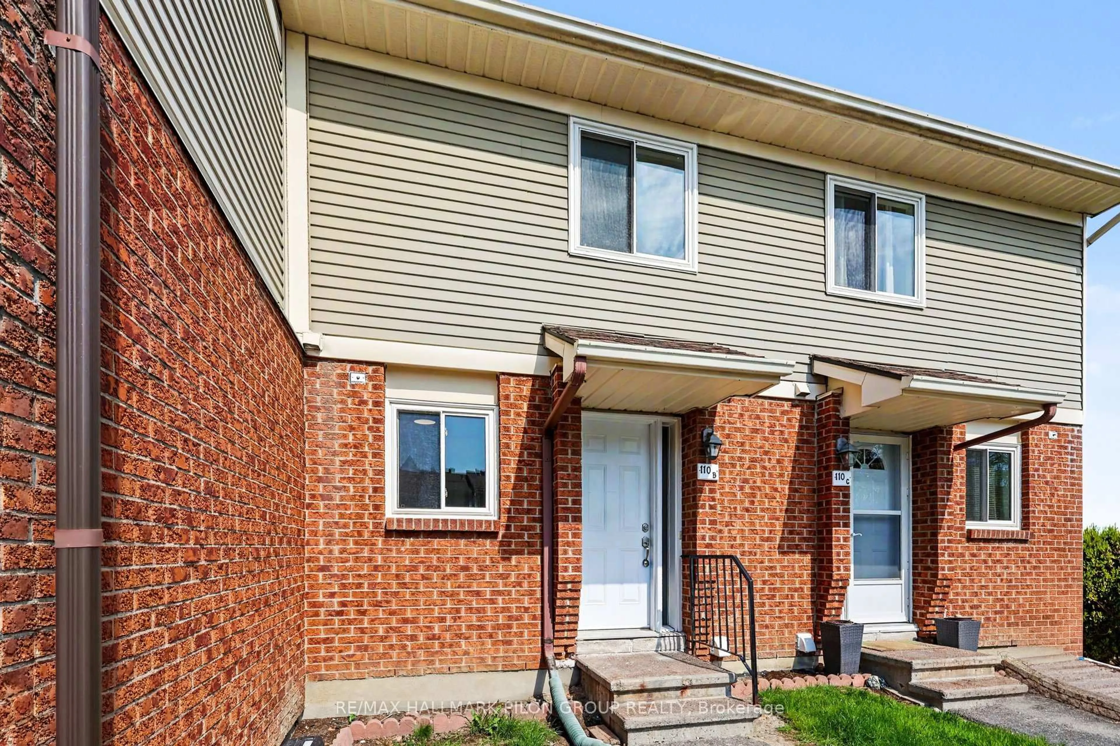 Home with brick exterior material, street for 110 Valley Stream Dr #B, Ottawa Ontario K2H 9E1