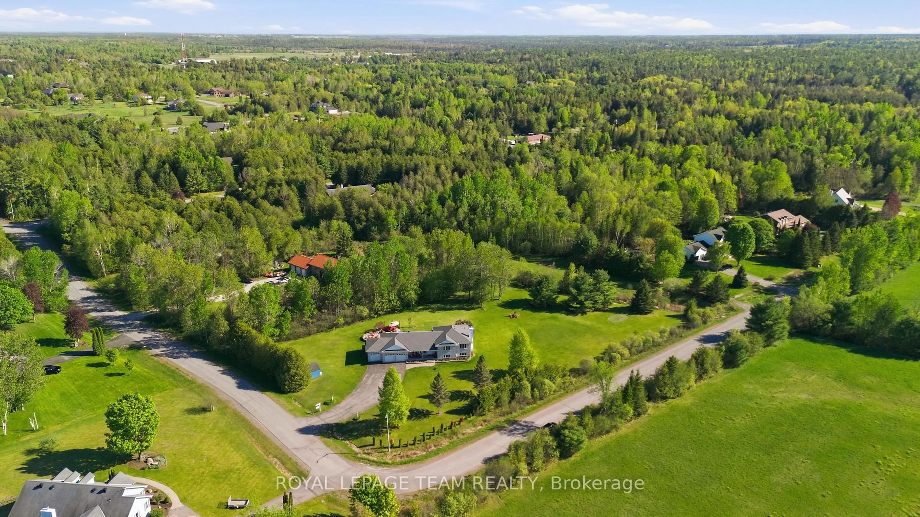 A pic from outside/outdoor area/front of a property/back of a property/a pic from drone, forest/trees view for 118 Rushing Brook Dr, Carp Ontario K0A 1L0