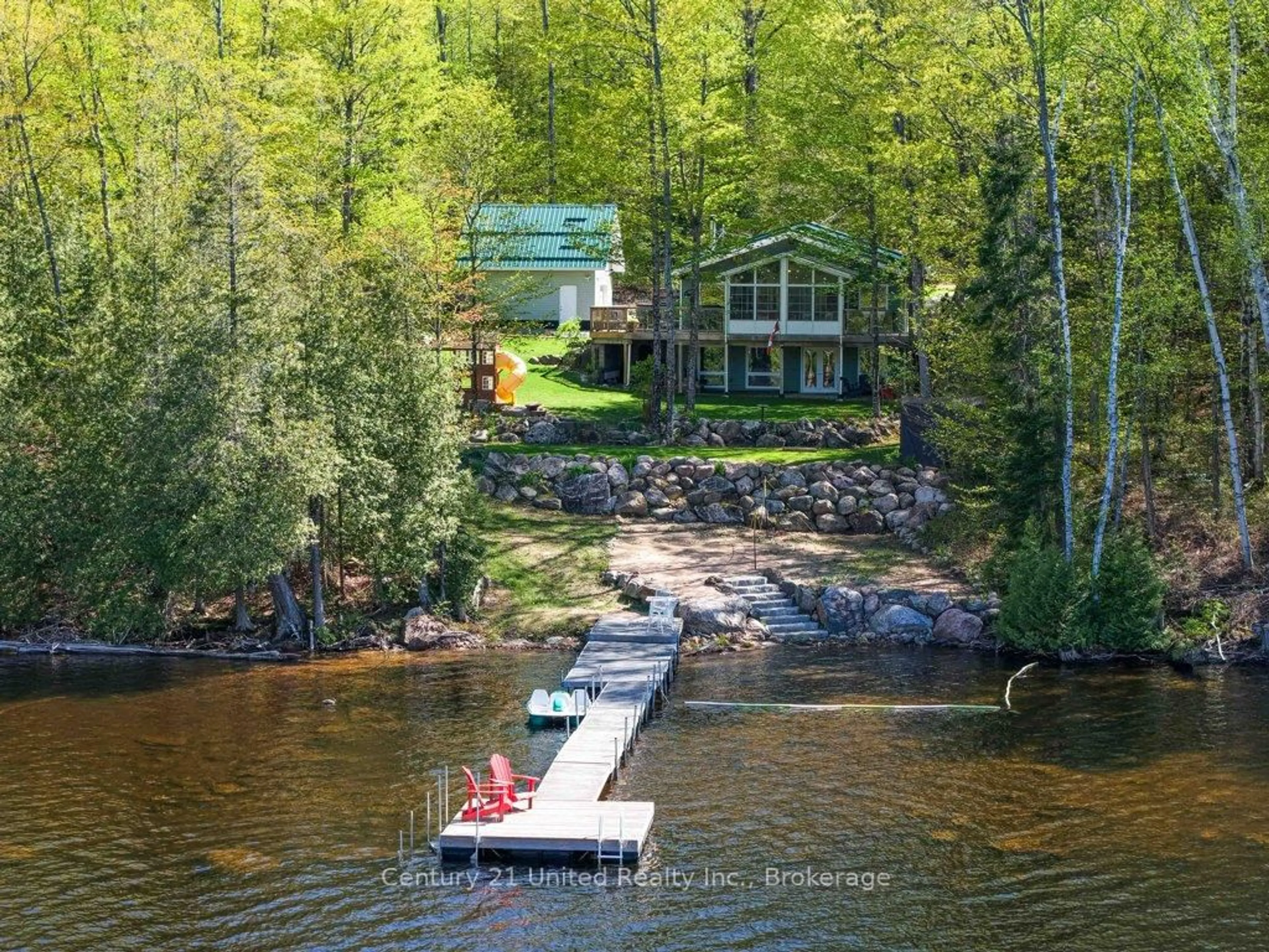 A pic from outside/outdoor area/front of a property/back of a property/a pic from drone, water/lake/river/ocean view for 1120 Surveyor Dr, Highlands East Ontario K0L 2Y0
