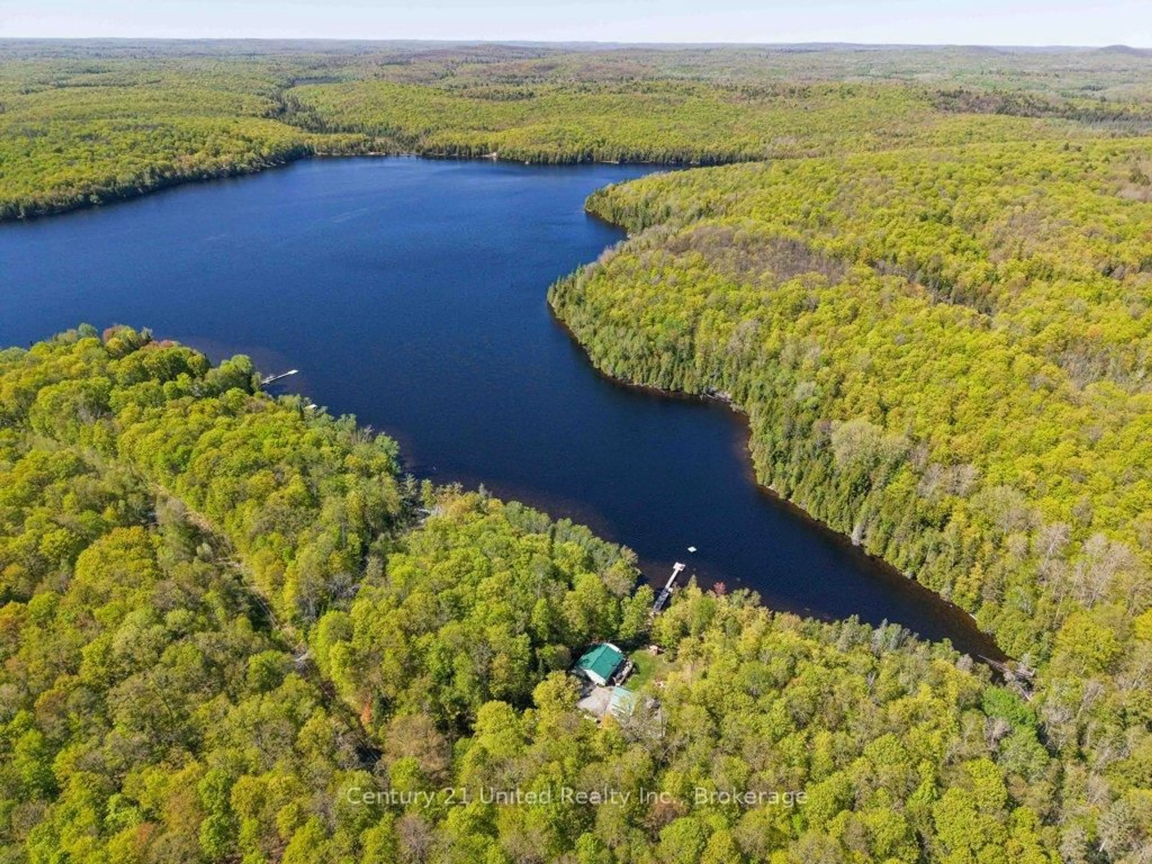 A pic from outside/outdoor area/front of a property/back of a property/a pic from drone, water/lake/river/ocean view for 1120 Surveyor Dr, Highlands East Ontario K0L 2Y0