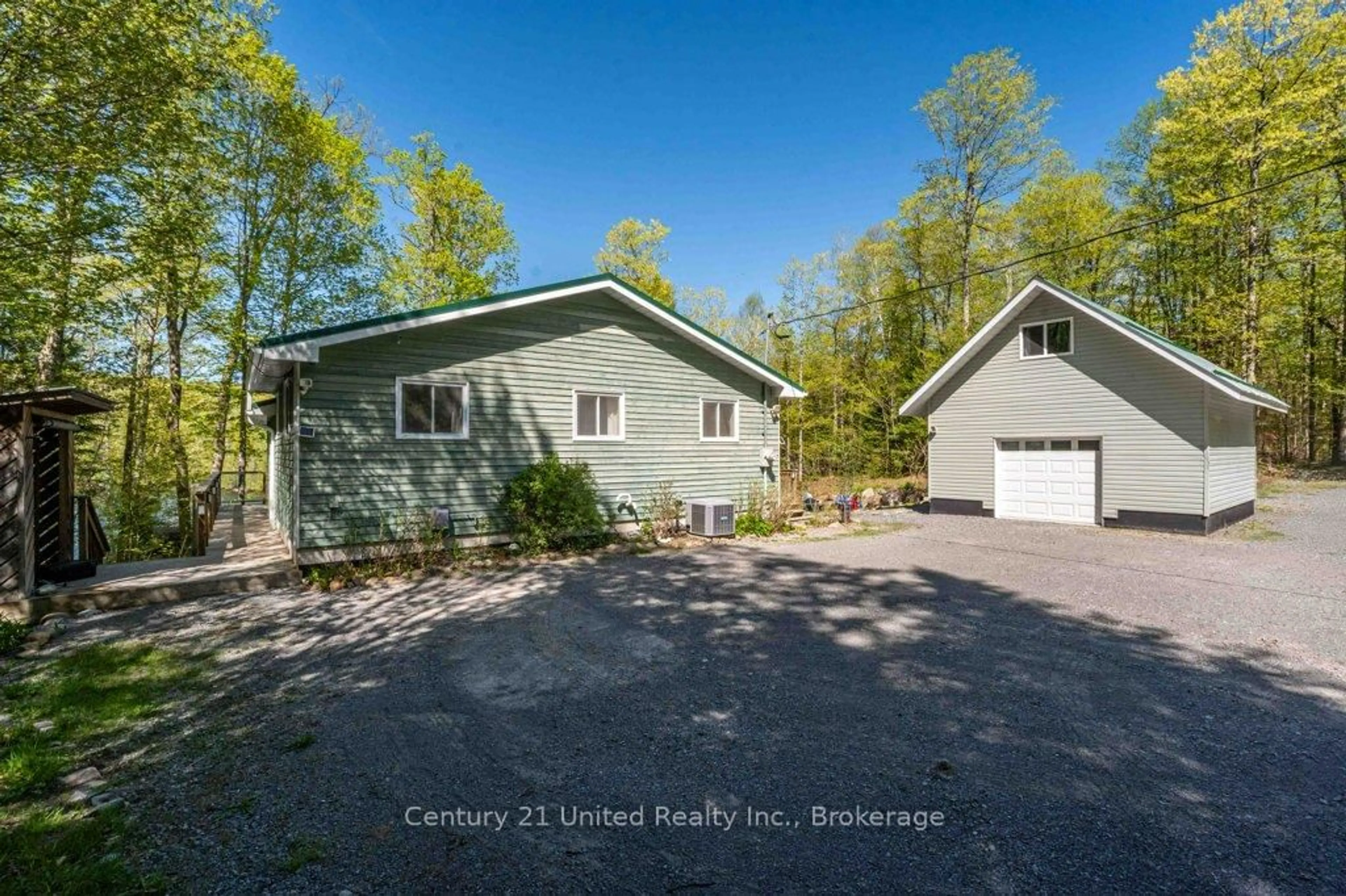 A pic from outside/outdoor area/front of a property/back of a property/a pic from drone, water/lake/river/ocean view for 1120 Surveyor Dr, Highlands East Ontario K0L 2Y0