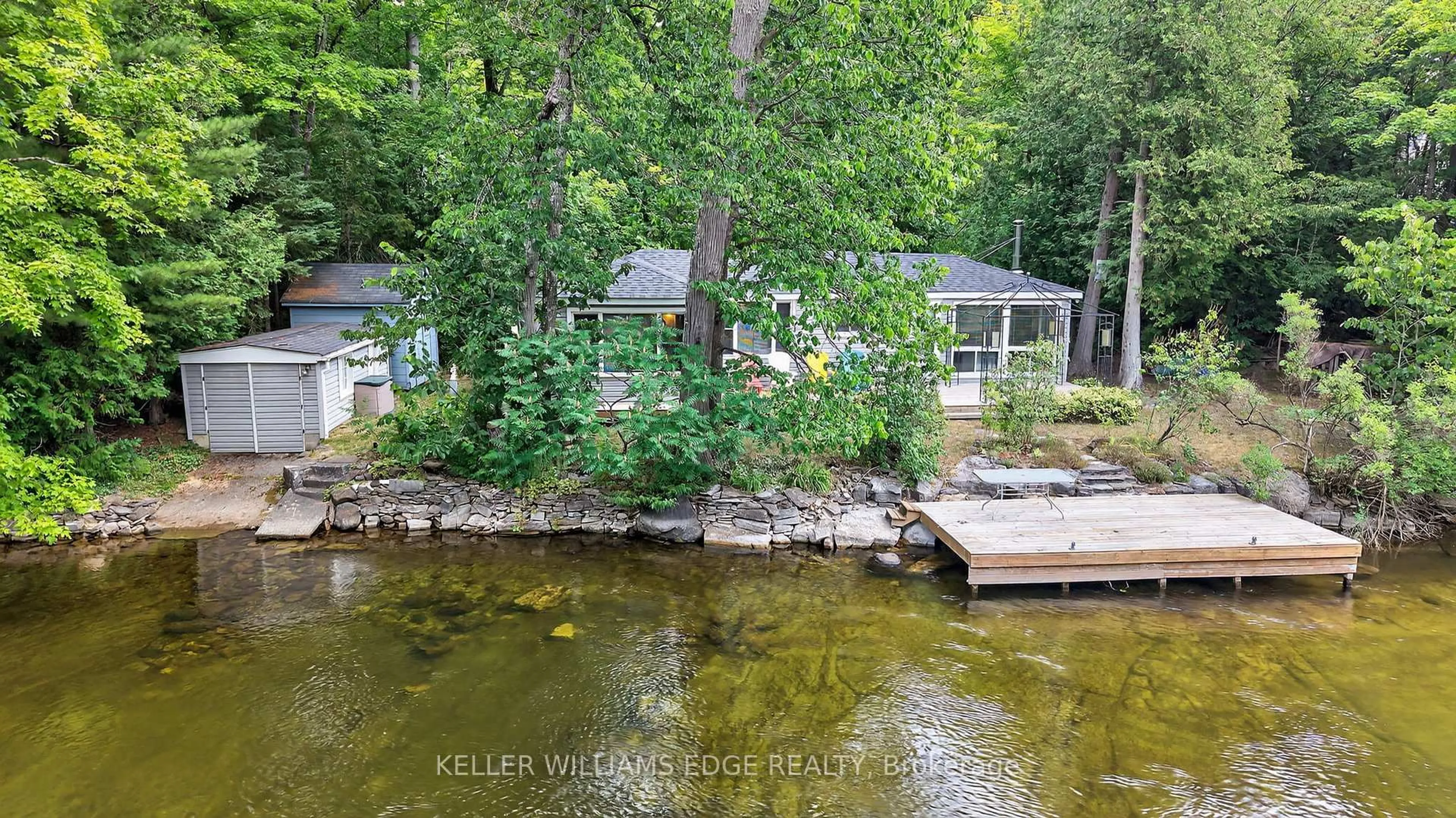 A pic from outside/outdoor area/front of a property/back of a property/a pic from drone, water/lake/river/ocean view for 92 Shadow Lake Rd 28 Rd, Kawartha Lakes Ontario K0M 1K0