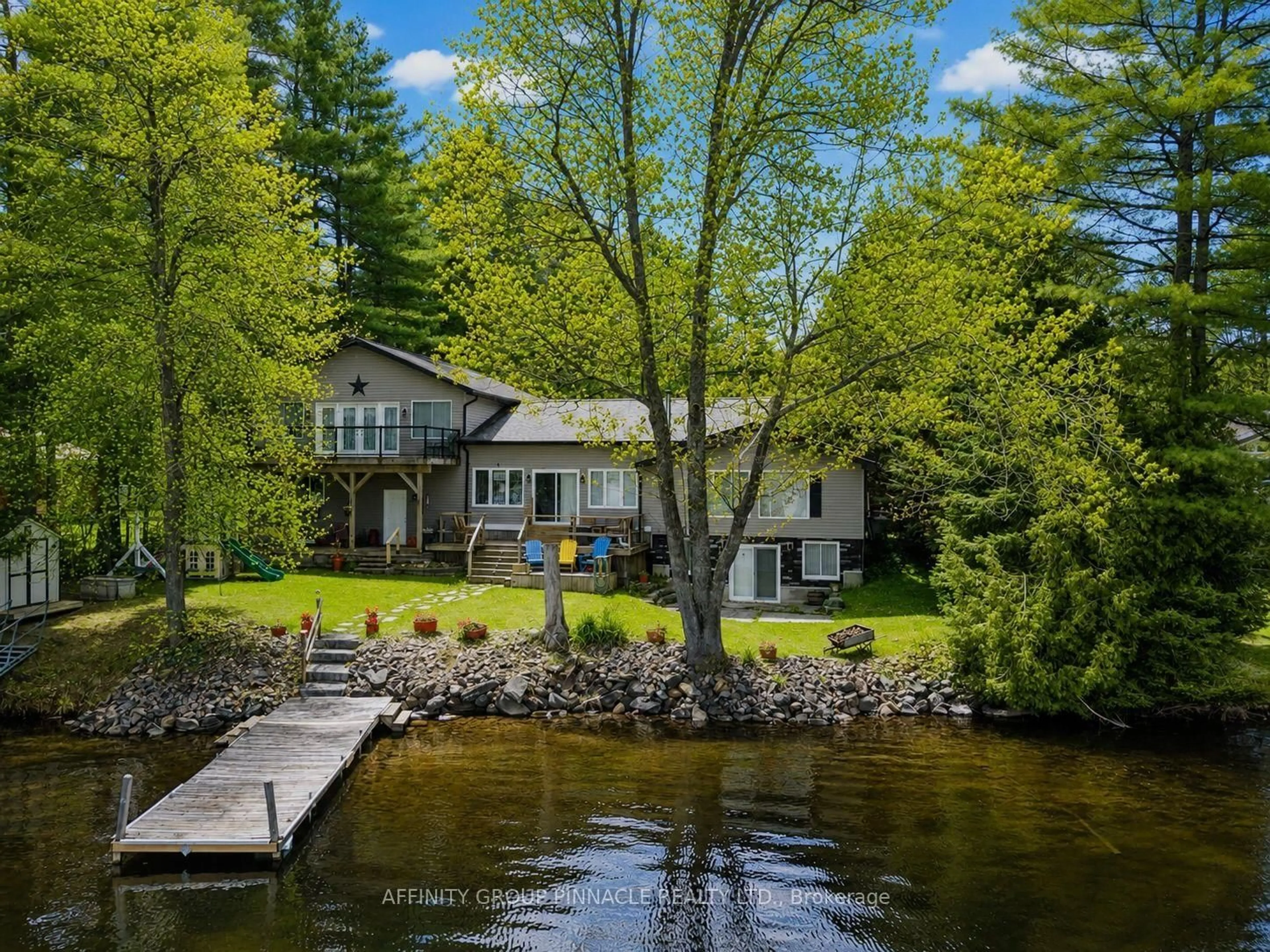 A pic from outside/outdoor area/front of a property/back of a property/a pic from drone, water/lake/river/ocean view for 1150 Moore Lake Estates Rd, Minden Hills Ontario K0M 2L1