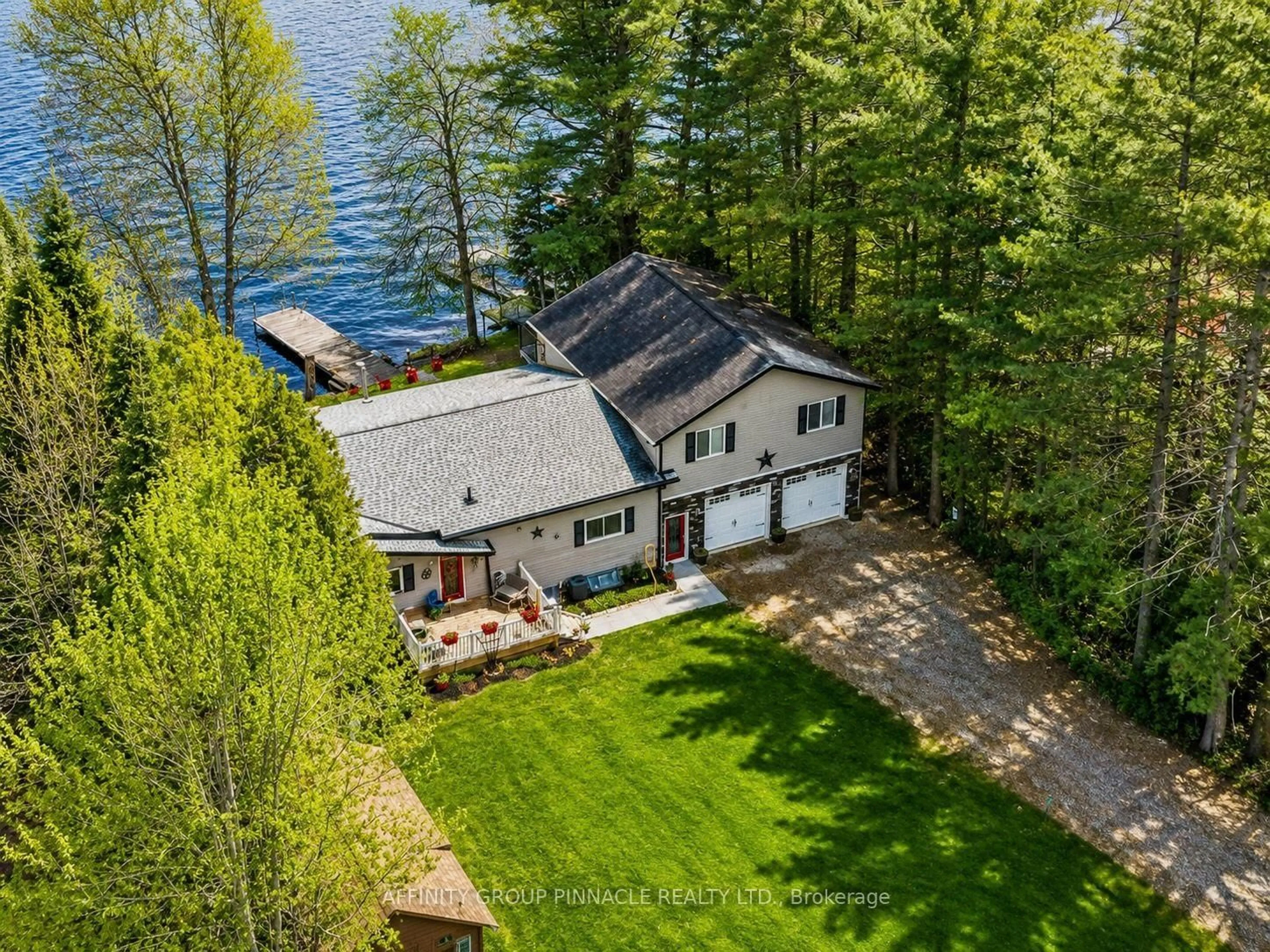 A pic from outside/outdoor area/front of a property/back of a property/a pic from drone, water/lake/river/ocean view for 1150 Moore Lake Estates Rd, Minden Hills Ontario K0M 2L1