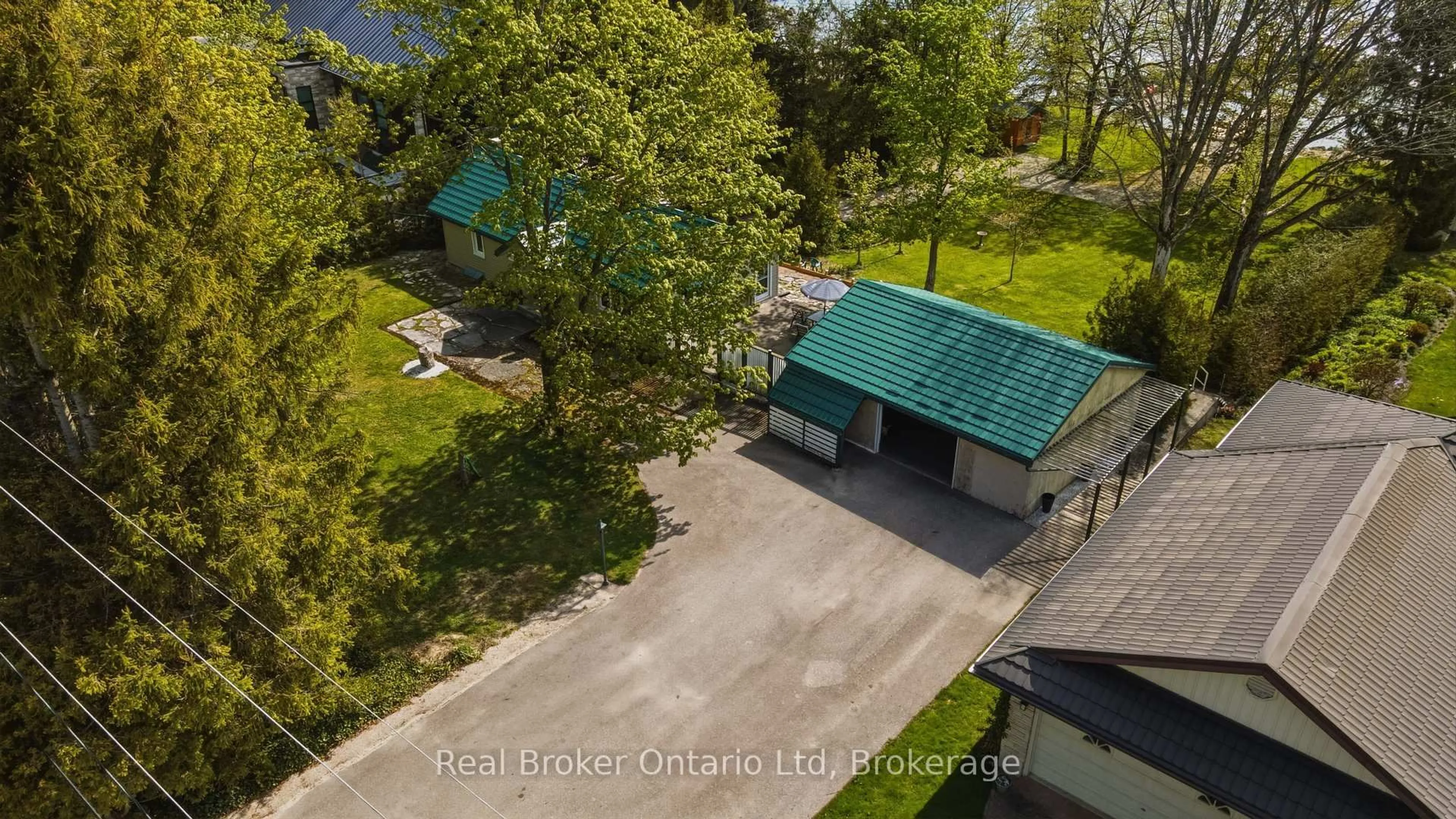 A pic from outside/outdoor area/front of a property/back of a property/a pic from drone, water/lake/river/ocean view for 275 Balmy Beach Rd, Georgian Bluffs Ontario N4K 5N4