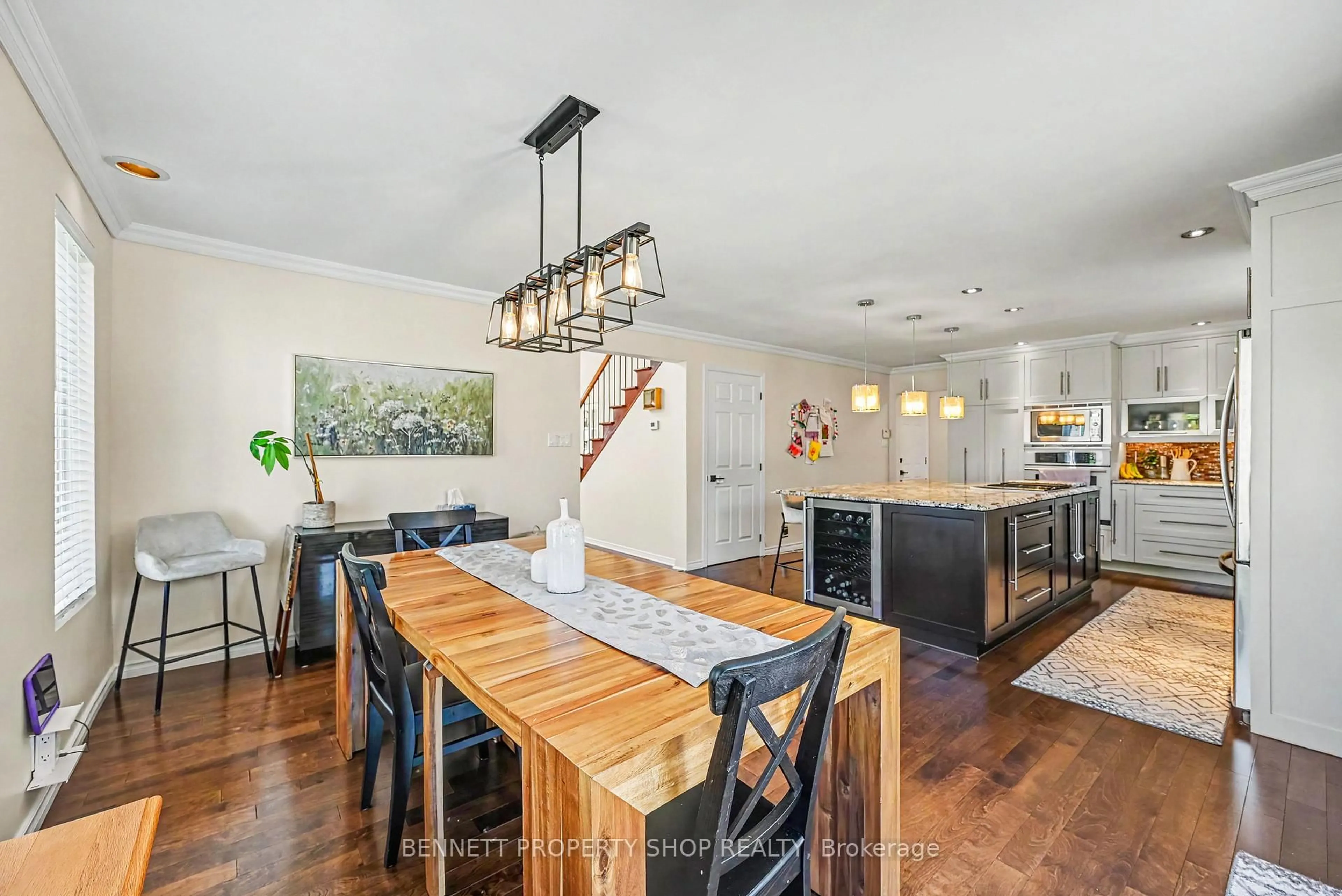 Open concept kitchen, wood/laminate floor for 875 Kenyon Cres, Cornwall Ontario K6H 6Z1