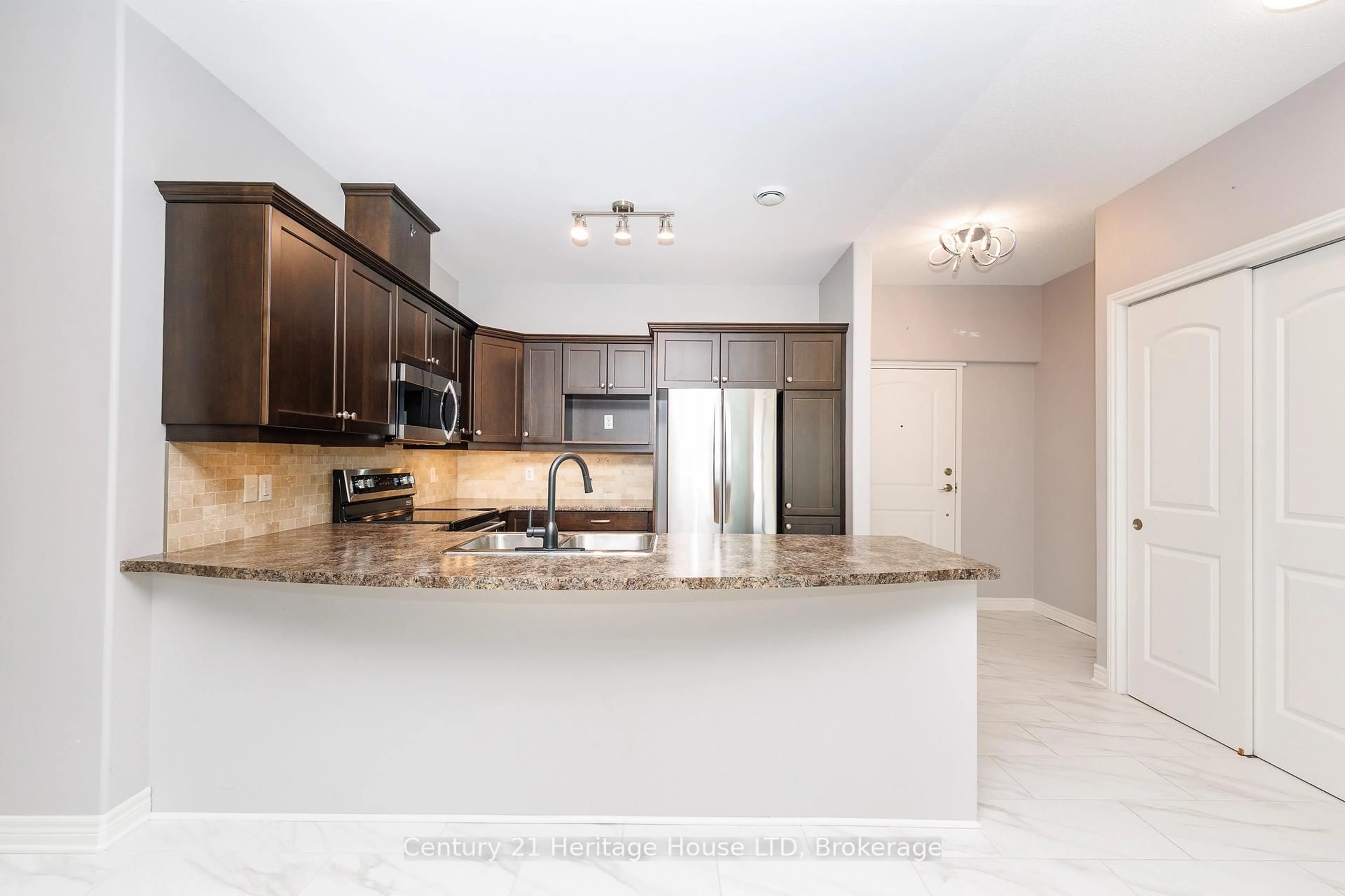 Open concept kitchen, ceramic/tile floor for 2799 St. Paul Ave #311, Niagara Falls Ontario L2J 2L3