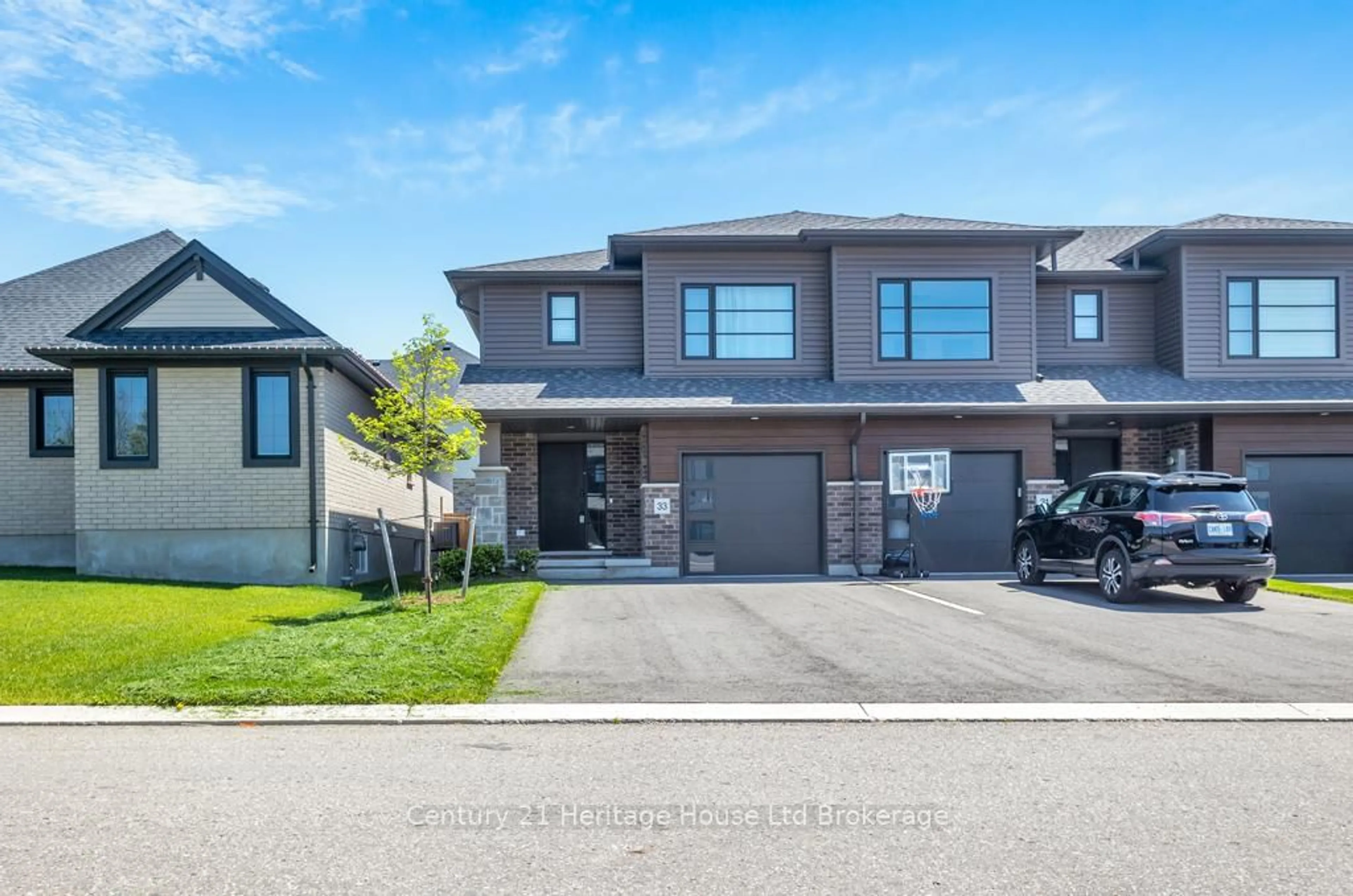 Home with brick exterior material, street for 33 Martin St, Tillsonburg Ontario N4G 0K3