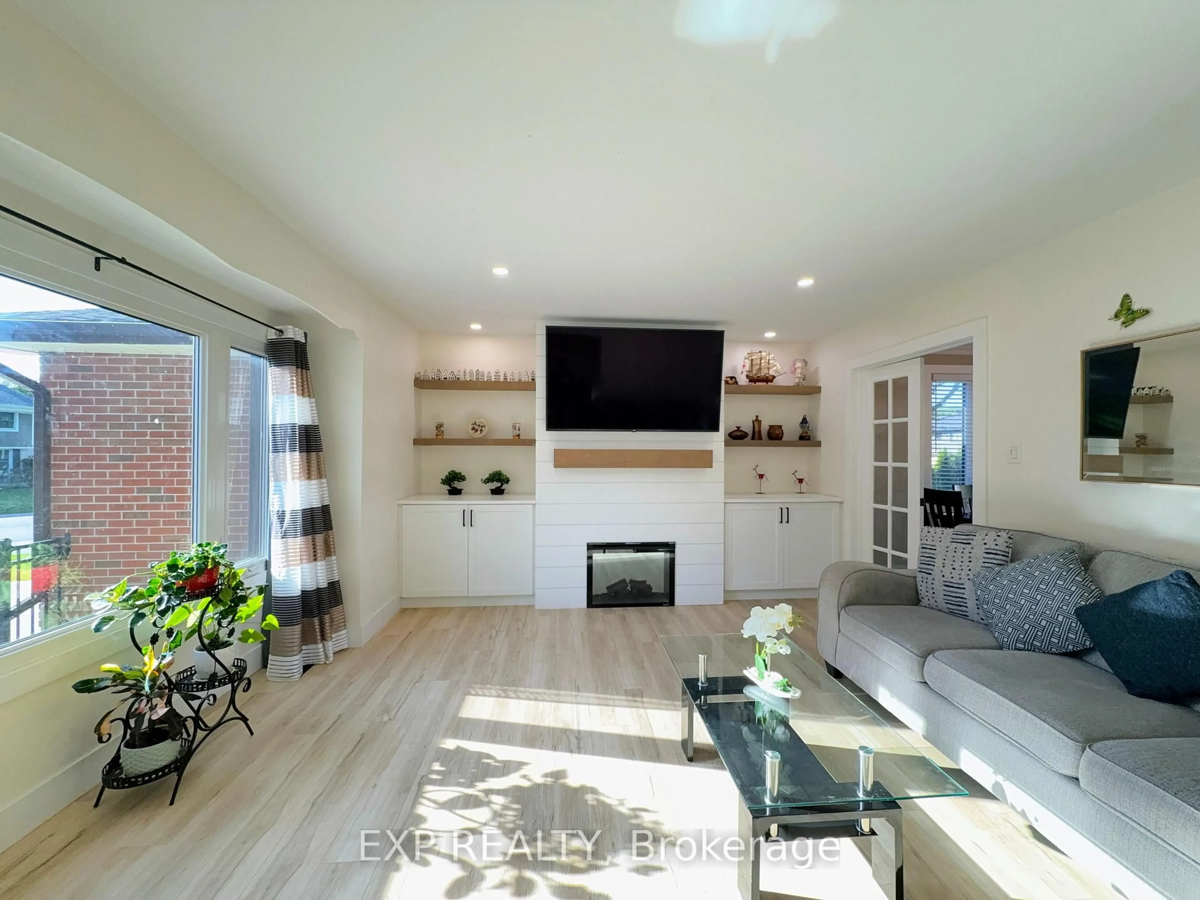 Living room with furniture, wood/laminate floor for 30 COWAN Ave, London South Ontario N6C 4E6