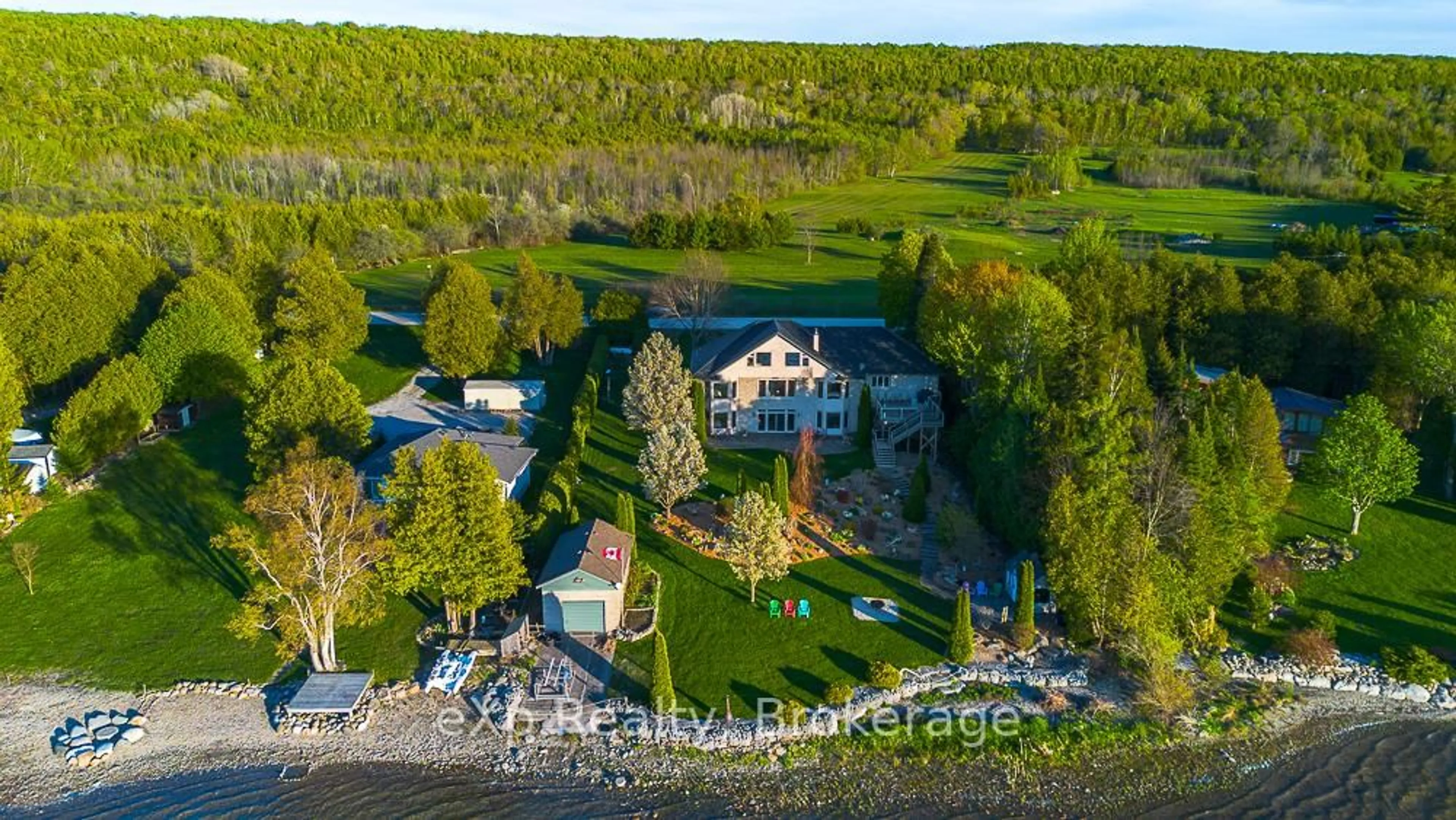 A pic from outside/outdoor area/front of a property/back of a property/a pic from drone, water/lake/river/ocean view for 502411 Grey Road 1 Rd, Georgian Bluffs Ontario N0H 2T0