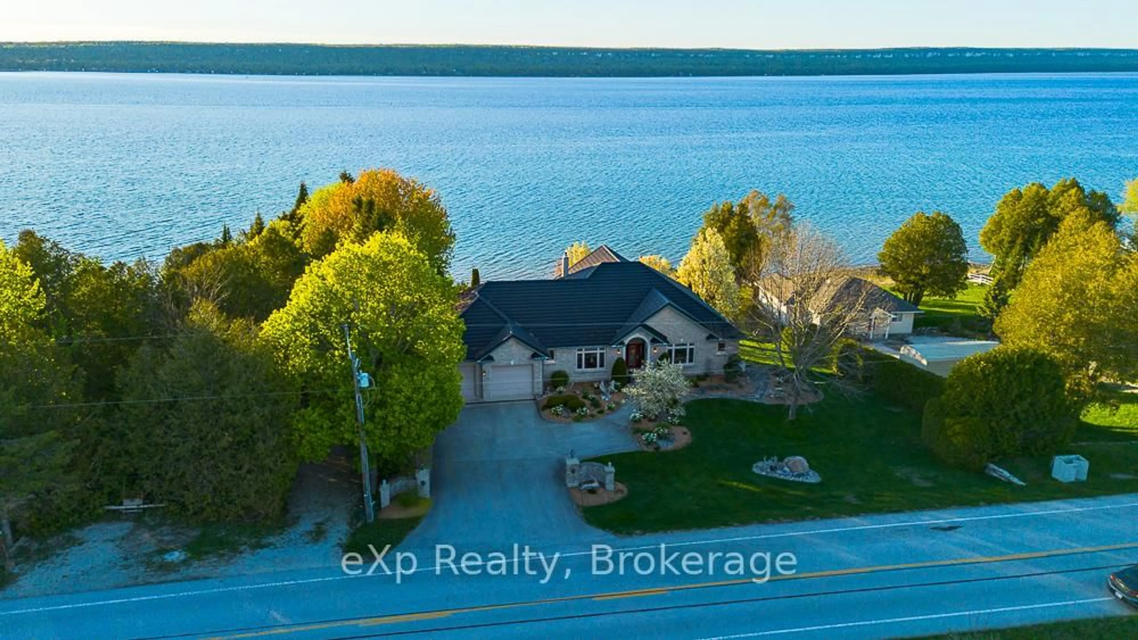 A pic from outside/outdoor area/front of a property/back of a property/a pic from drone, water/lake/river/ocean view for 502411 Grey Road 1 Rd, Georgian Bluffs Ontario N0H 2T0