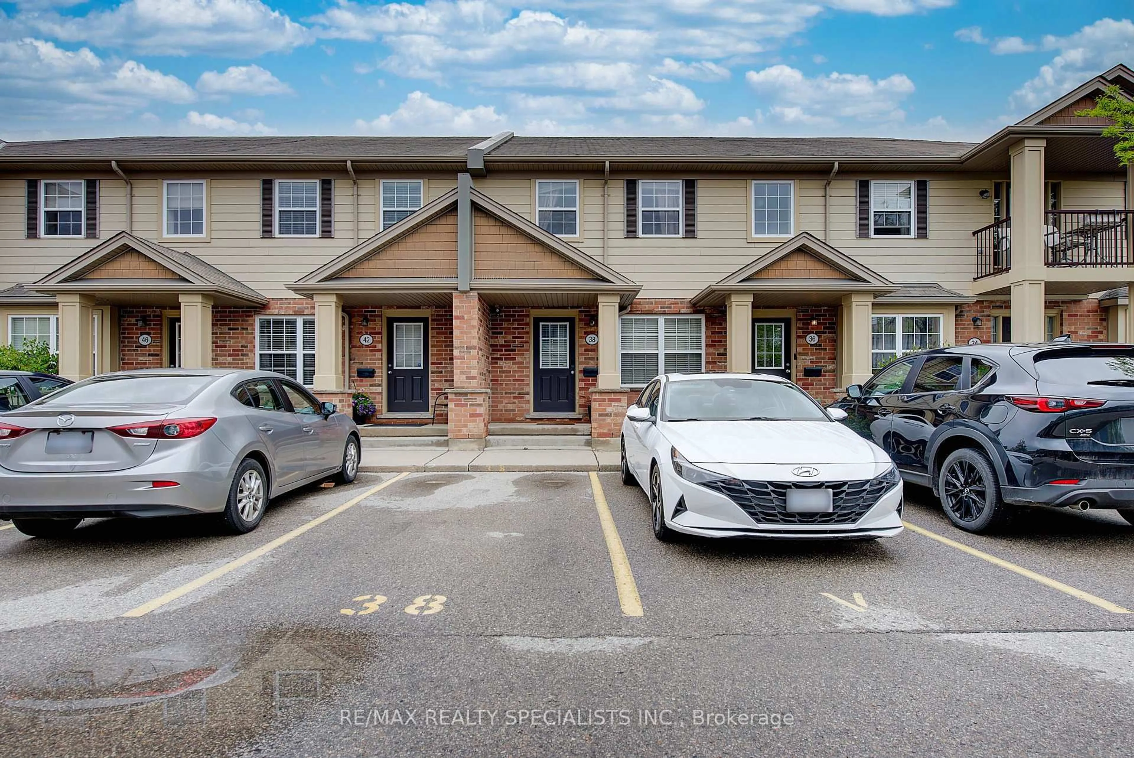 A pic from outside/outdoor area/front of a property/back of a property/a pic from drone, street for 3320 Meadowgate Blvd #38, London South Ontario N6M 0A2
