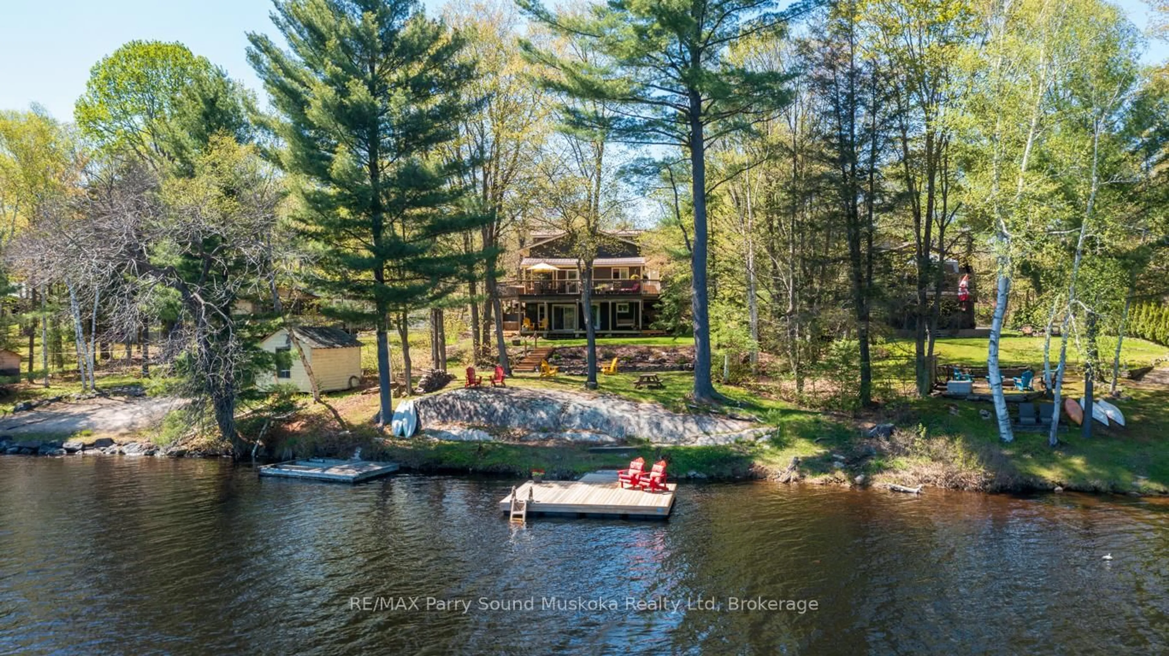 A pic from outside/outdoor area/front of a property/back of a property/a pic from drone, water/lake/river/ocean view for 13 PENINSULA SHORES Rd, McDougall Ontario P2A 2W7