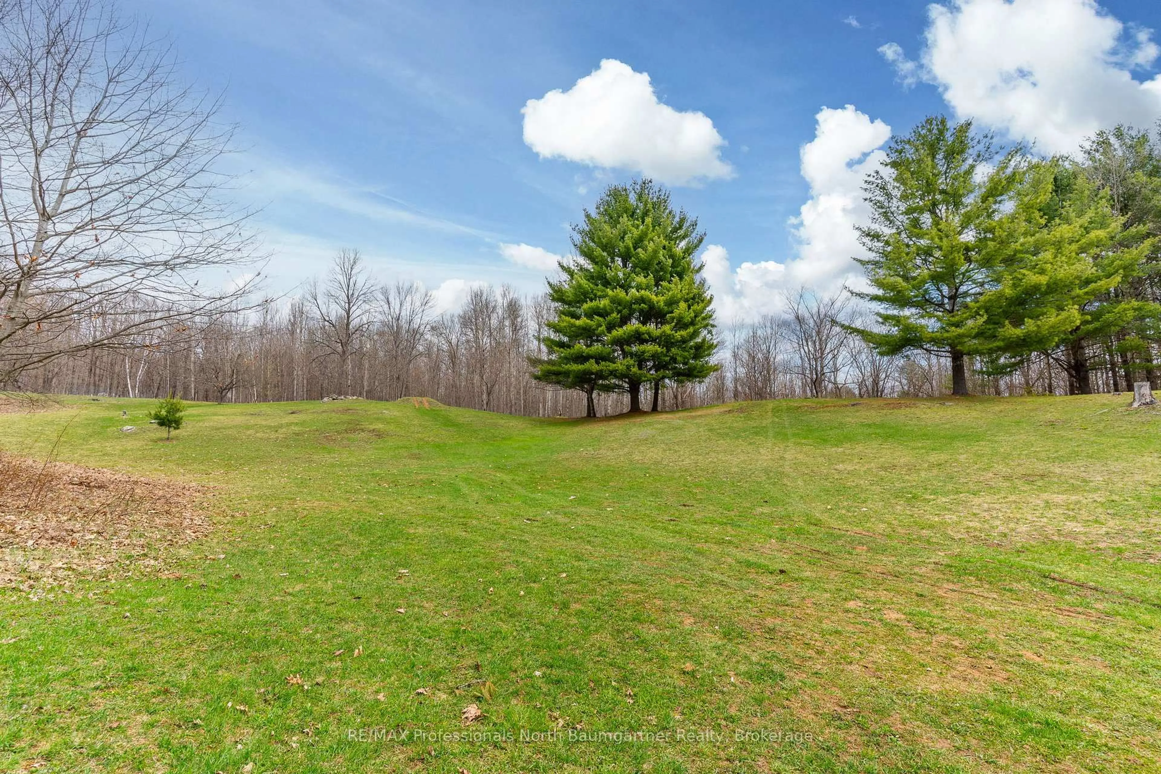 A pic from outside/outdoor area/front of a property/back of a property/a pic from drone, forest/trees view for 1093 Reynolds Rd, Minden Hills Ontario K0M 2K0