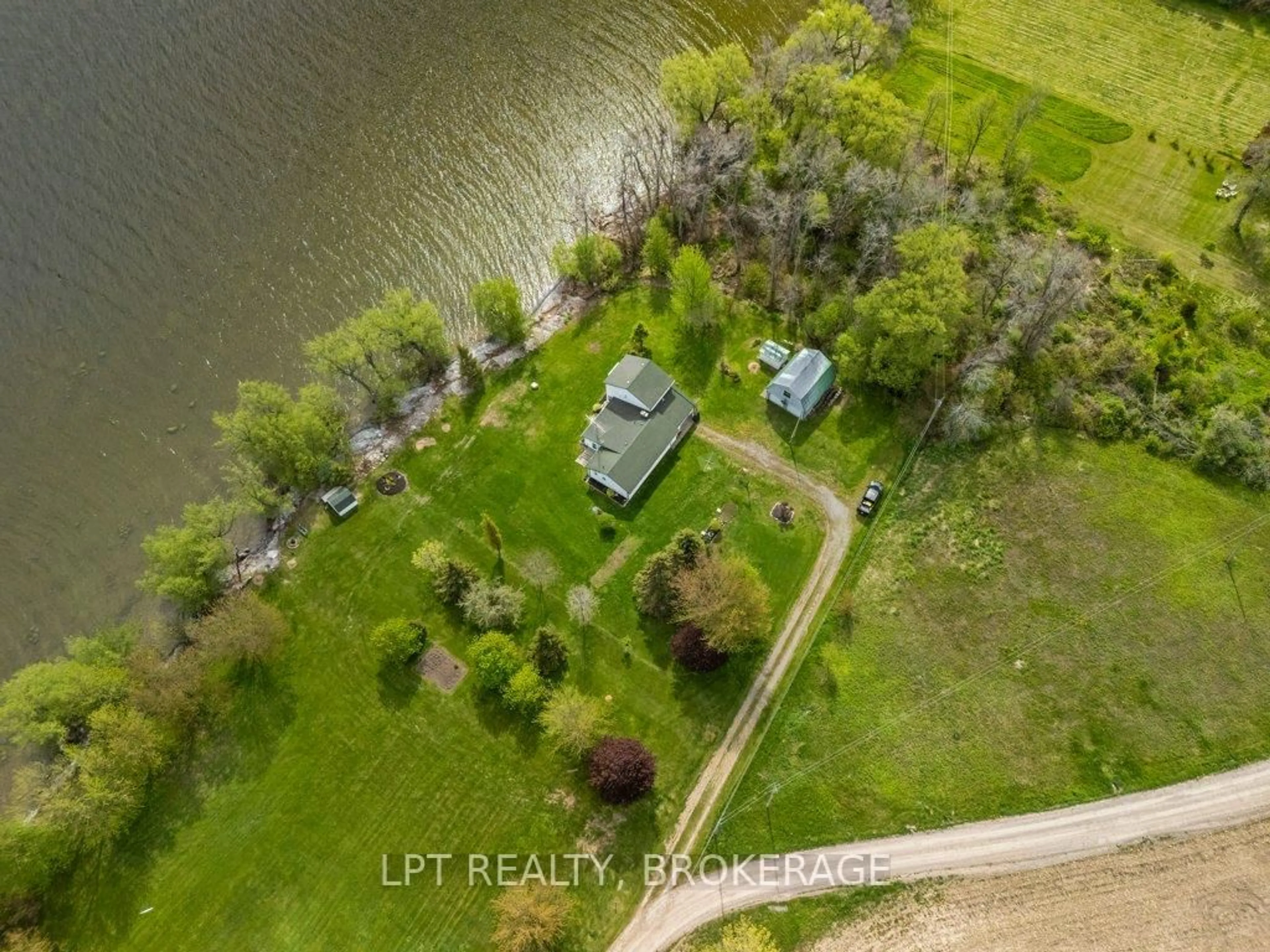 A pic from outside/outdoor area/front of a property/back of a property/a pic from drone, water/lake/river/ocean view for 159 Point Pleasant Lane, Prince Edward County Ontario K0K 2T0