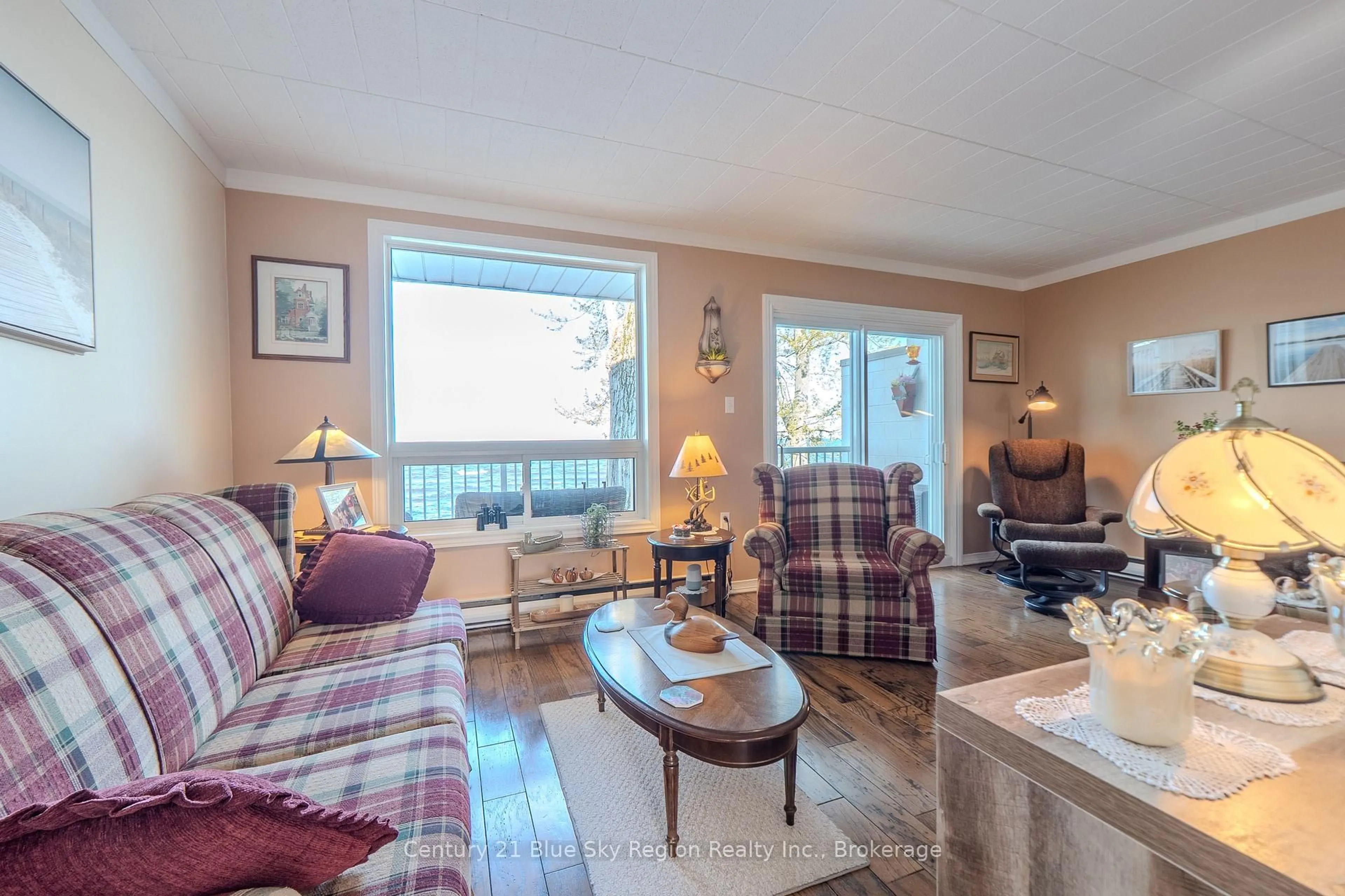 Living room with furniture, wood/laminate floor for 1205 Premier Rd #8, North Bay Ontario P1A 2J3