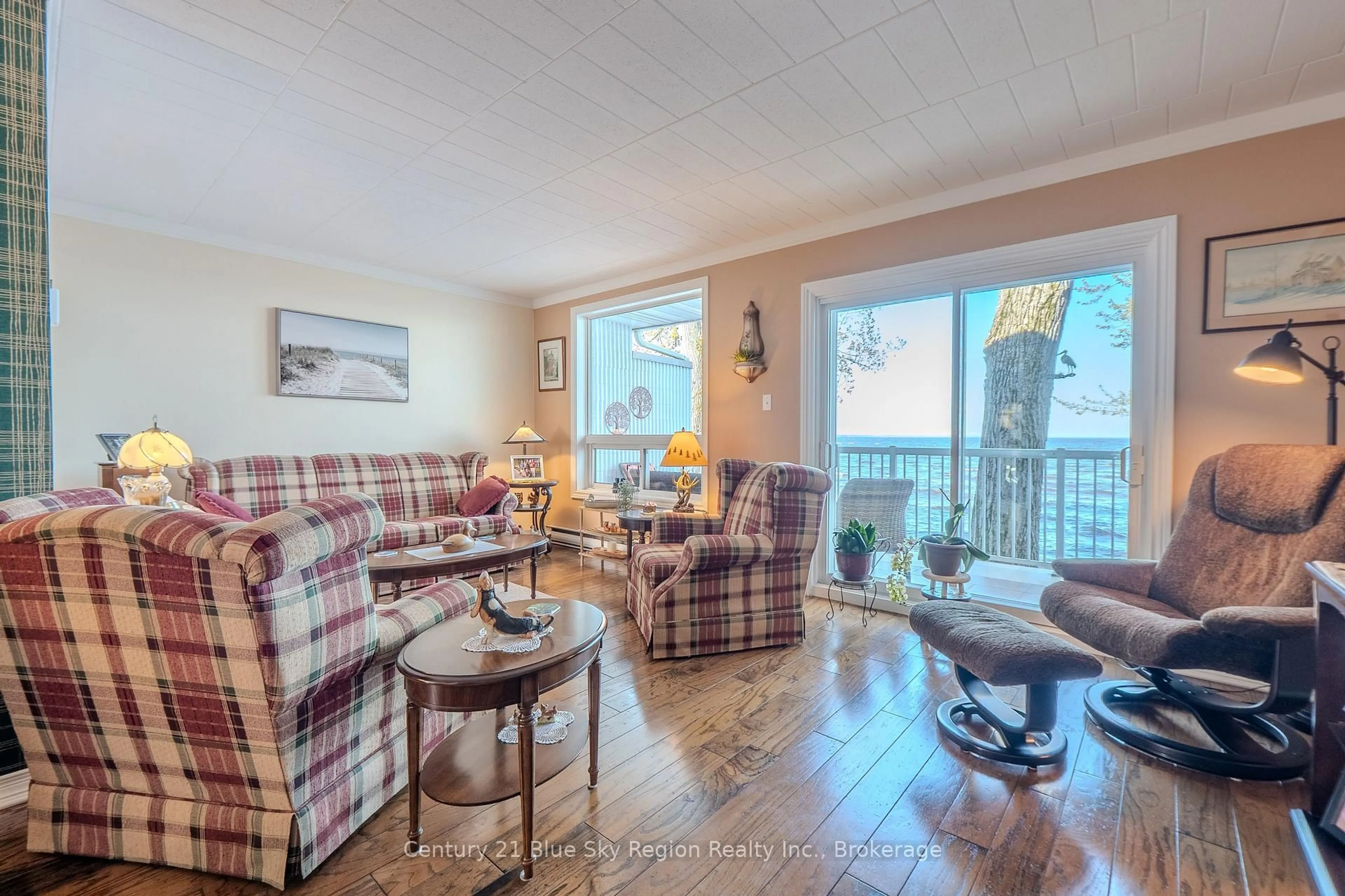 Living room with furniture, wood/laminate floor for 1205 Premier Rd #8, North Bay Ontario P1A 2J3