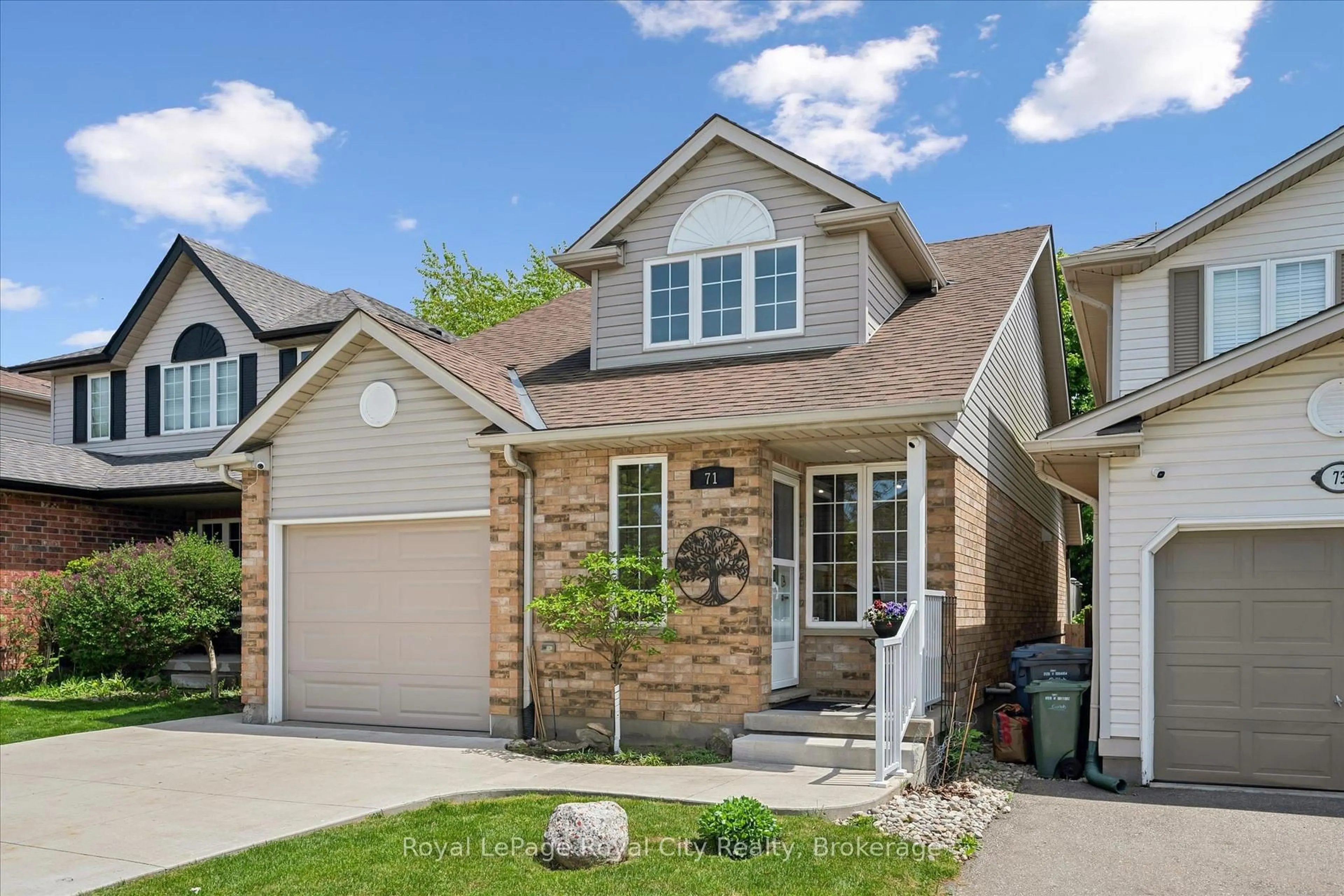 Home with brick exterior material, street for 71 Doyle Dr, Guelph Ontario N1G 5B9
