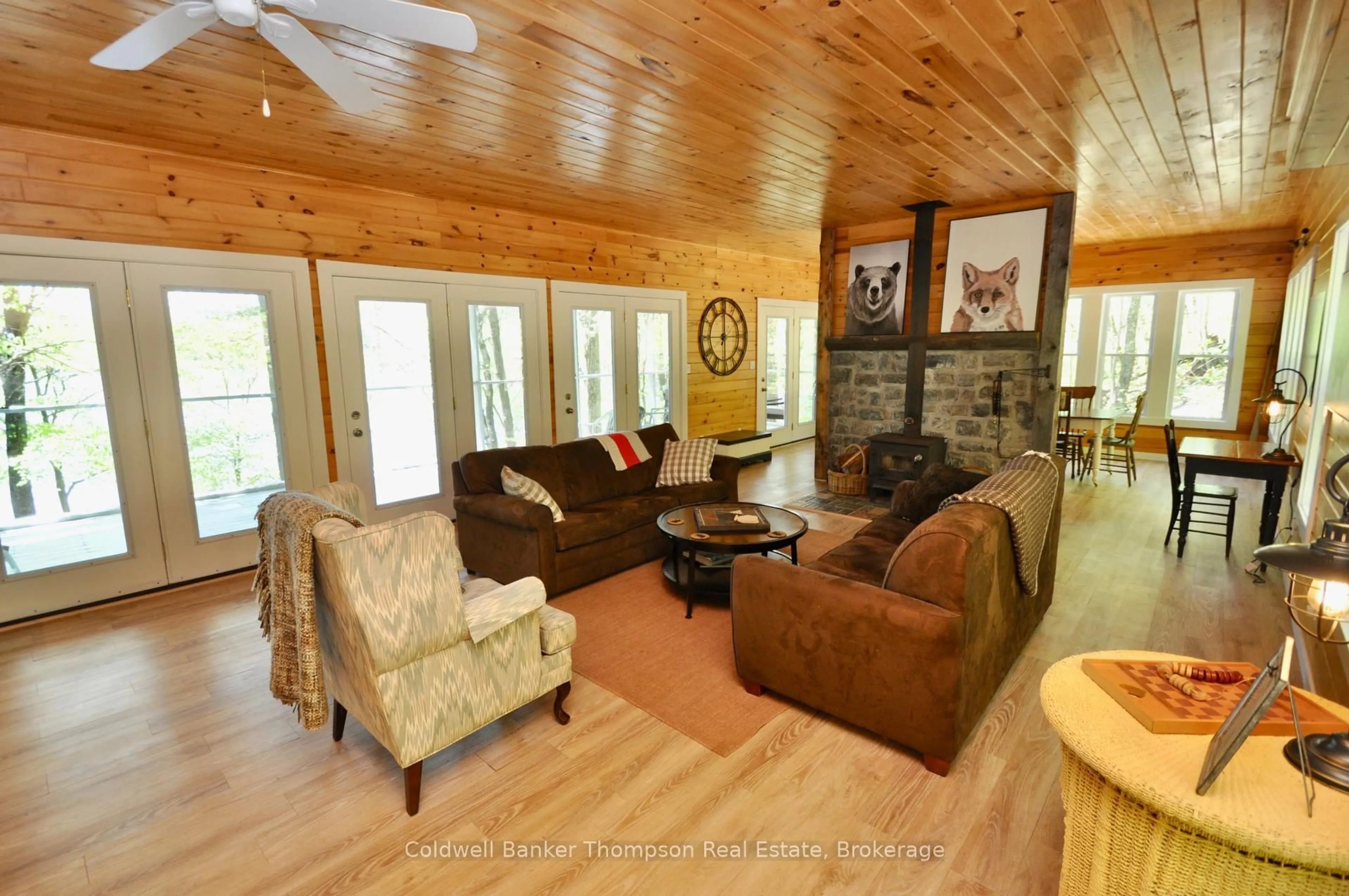Living room with furniture, wood/laminate floor for 768 Big Island, Huntsville Ontario P1H 2J2