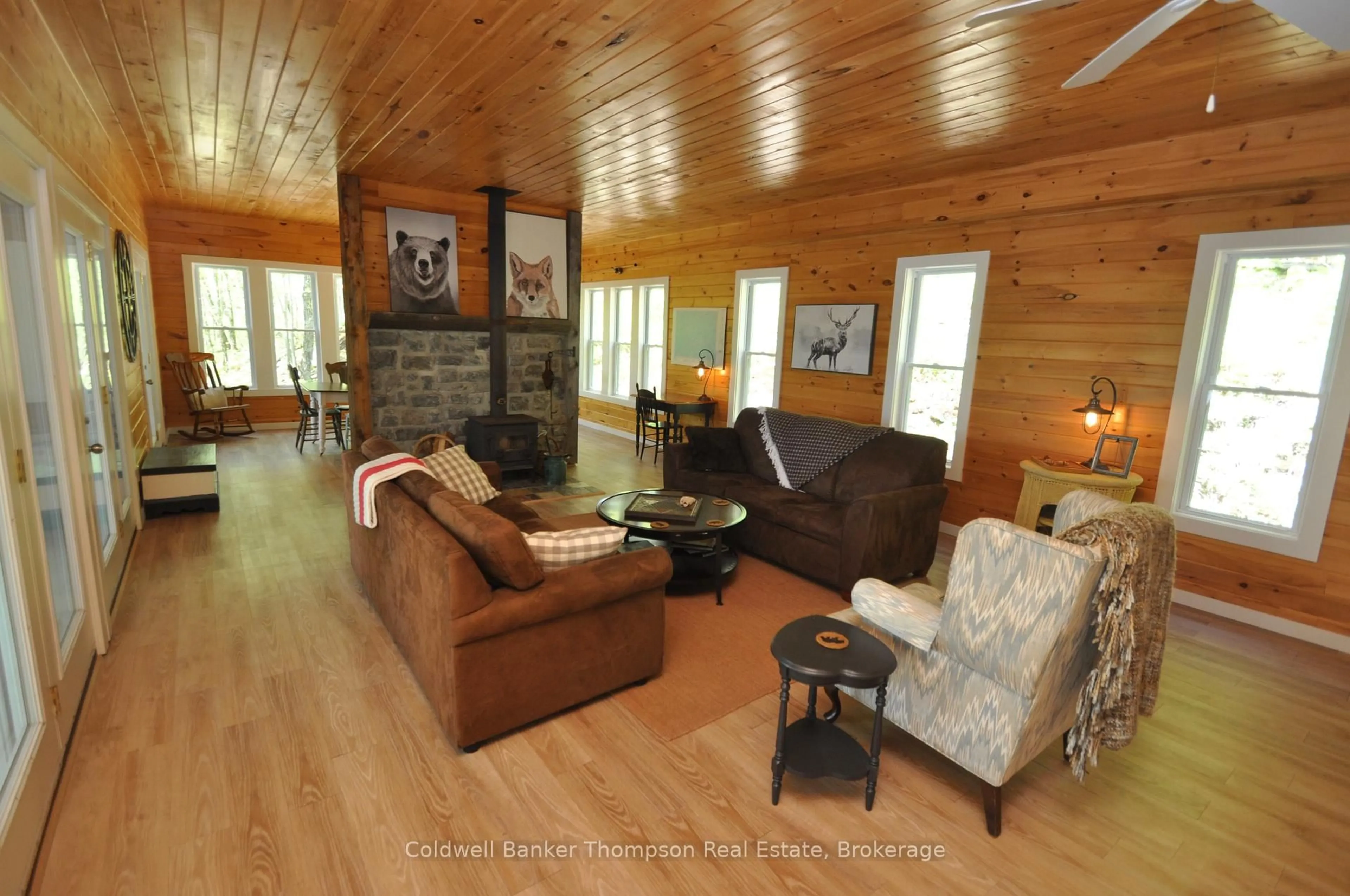 Living room with furniture, wood/laminate floor for 768 Big Island, Huntsville Ontario P1H 2J2