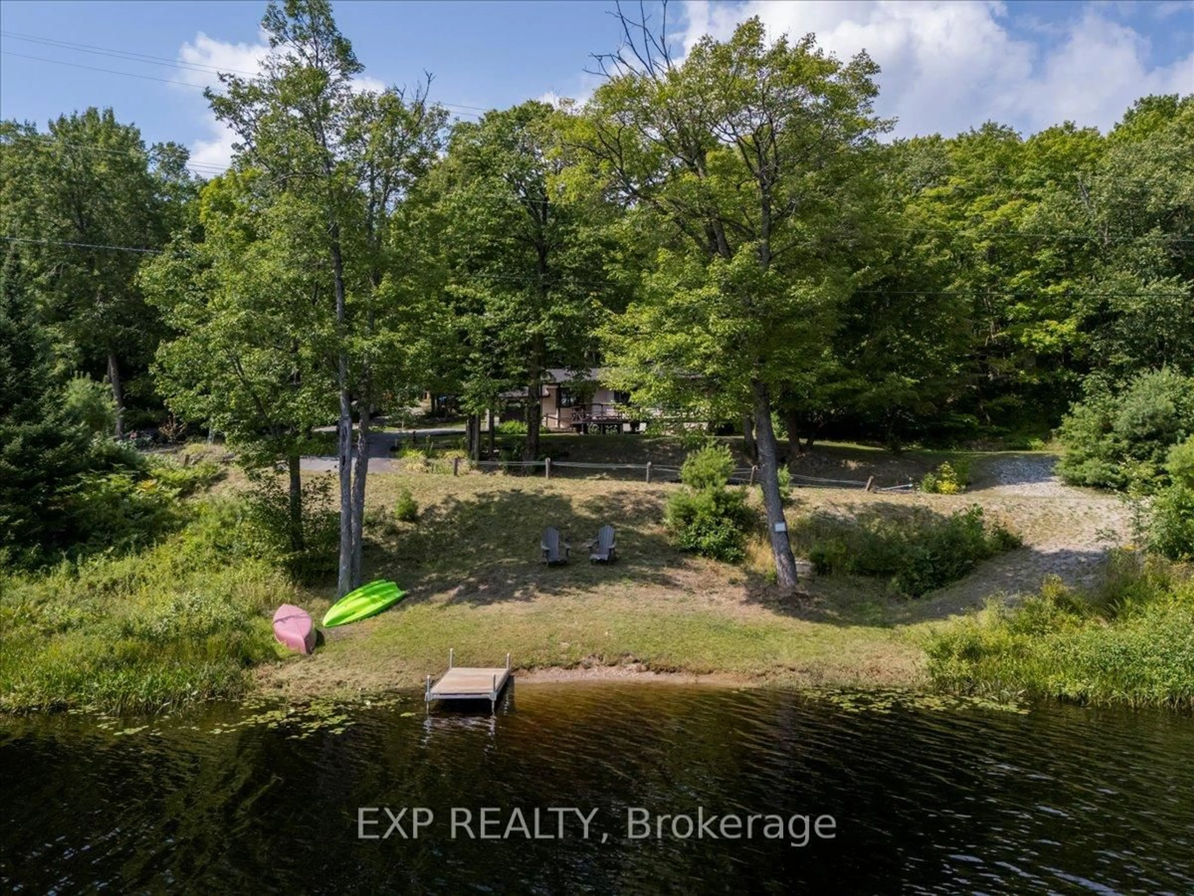 A pic from outside/outdoor area/front of a property/back of a property/a pic from drone, water/lake/river/ocean view for 1867 Fraserburg Rd, Bracebridge Ontario P1L 1X3
