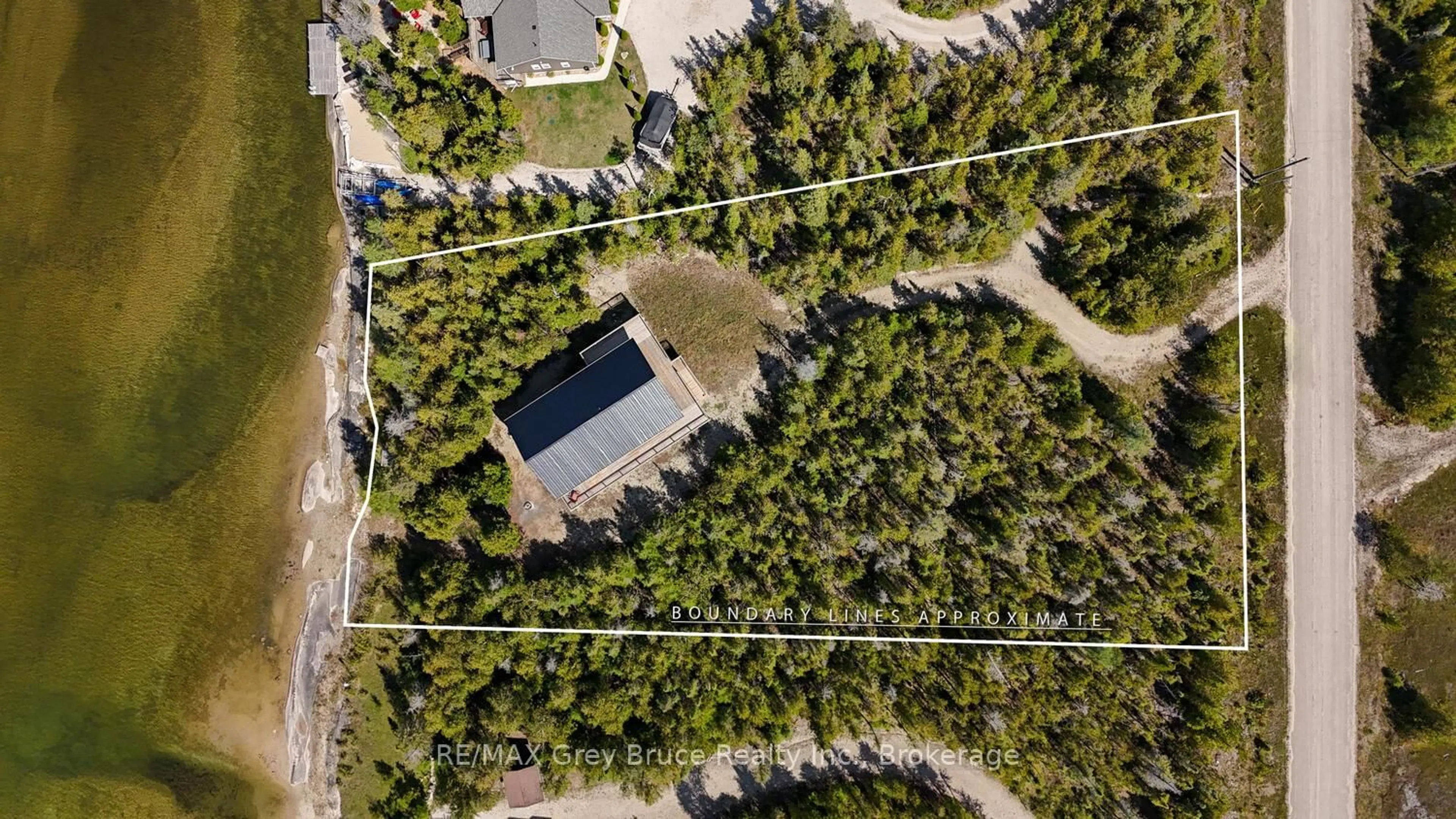 A pic from outside/outdoor area/front of a property/back of a property/a pic from drone, forest/trees view for 38 Bay Shore Ave, Northern Bruce Peninsula Ontario N0H 2R0
