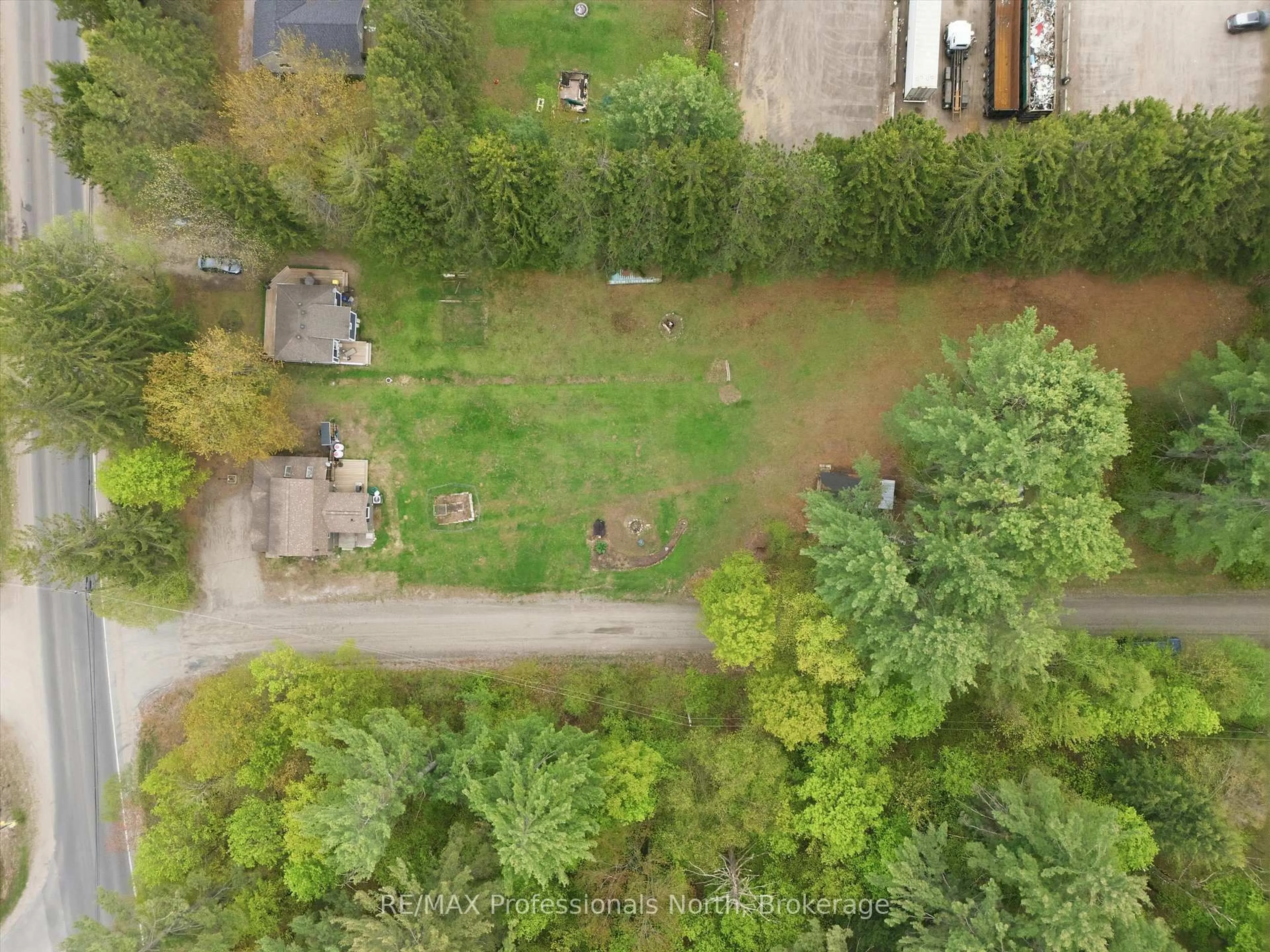 A pic from outside/outdoor area/front of a property/back of a property/a pic from drone, forest/trees view for 185 Muskoka 10 Rd, Huntsville Ontario P0B 1L0