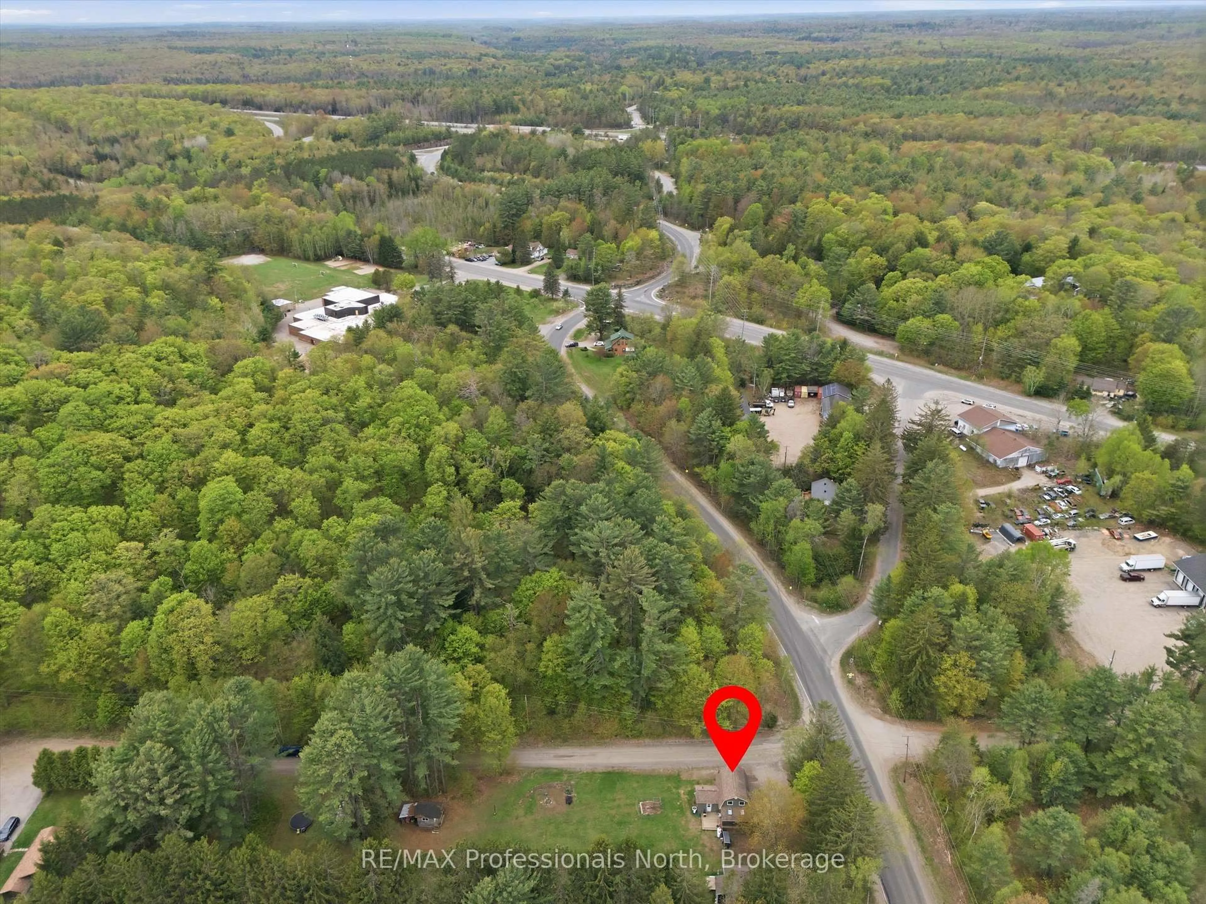 A pic from outside/outdoor area/front of a property/back of a property/a pic from drone, forest/trees view for 185 Muskoka 10 Rd, Huntsville Ontario P0B 1L0