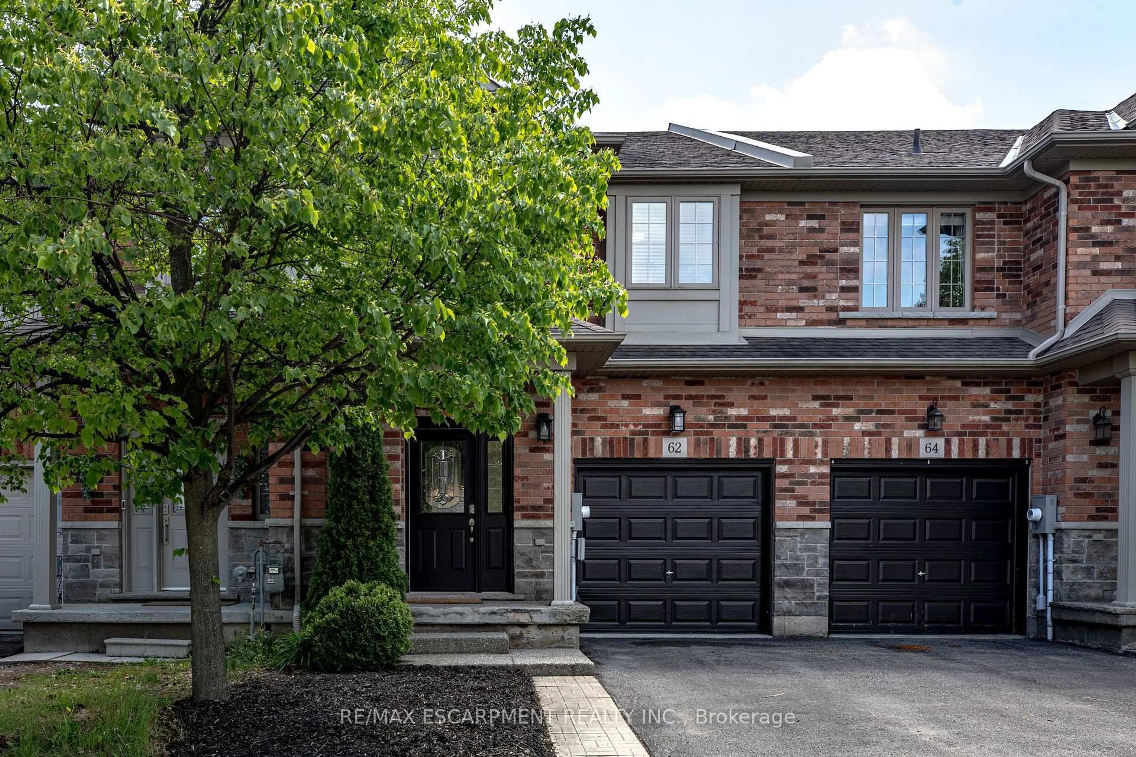 Home with brick exterior material, street for 62 Fall Fair Way, Hamilton Ontario L0R 1C0