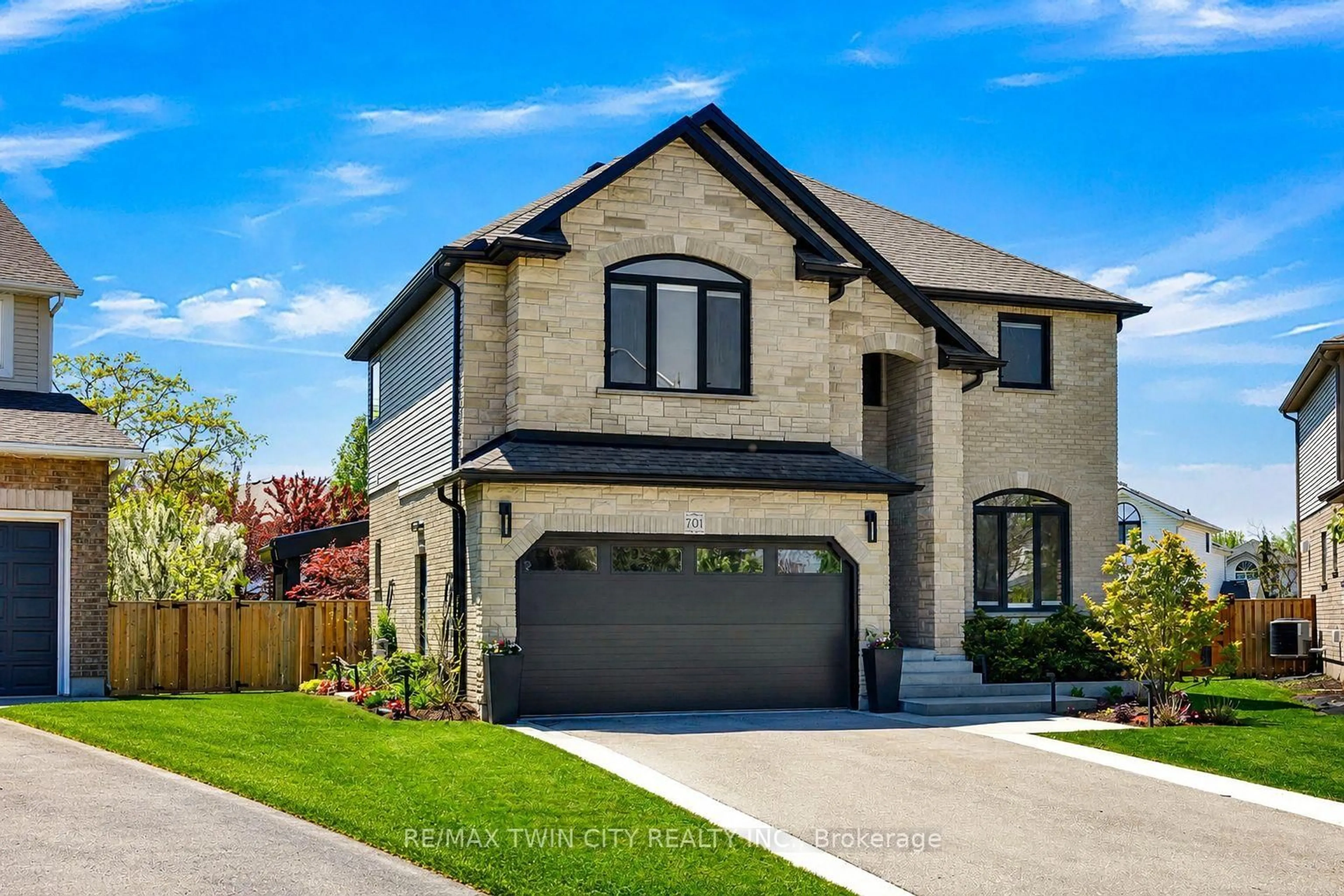 Home with brick exterior material, street for 701 Breakwater Cres, Waterloo Ontario N2K 4H8