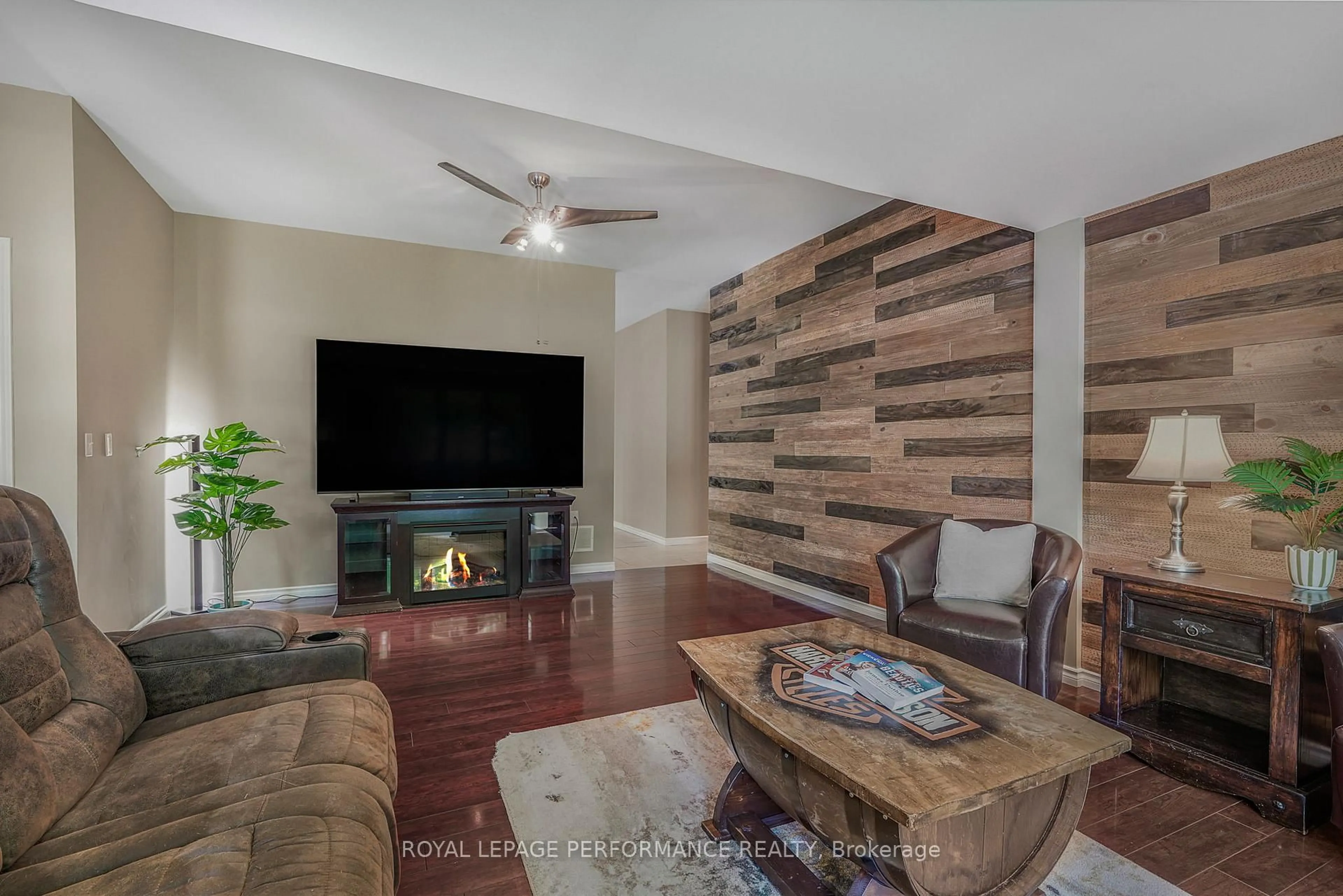 Living room with furniture, wood/laminate floor for 8872 Mitch Owens Rd, Ottawa Ontario K0A 1V0