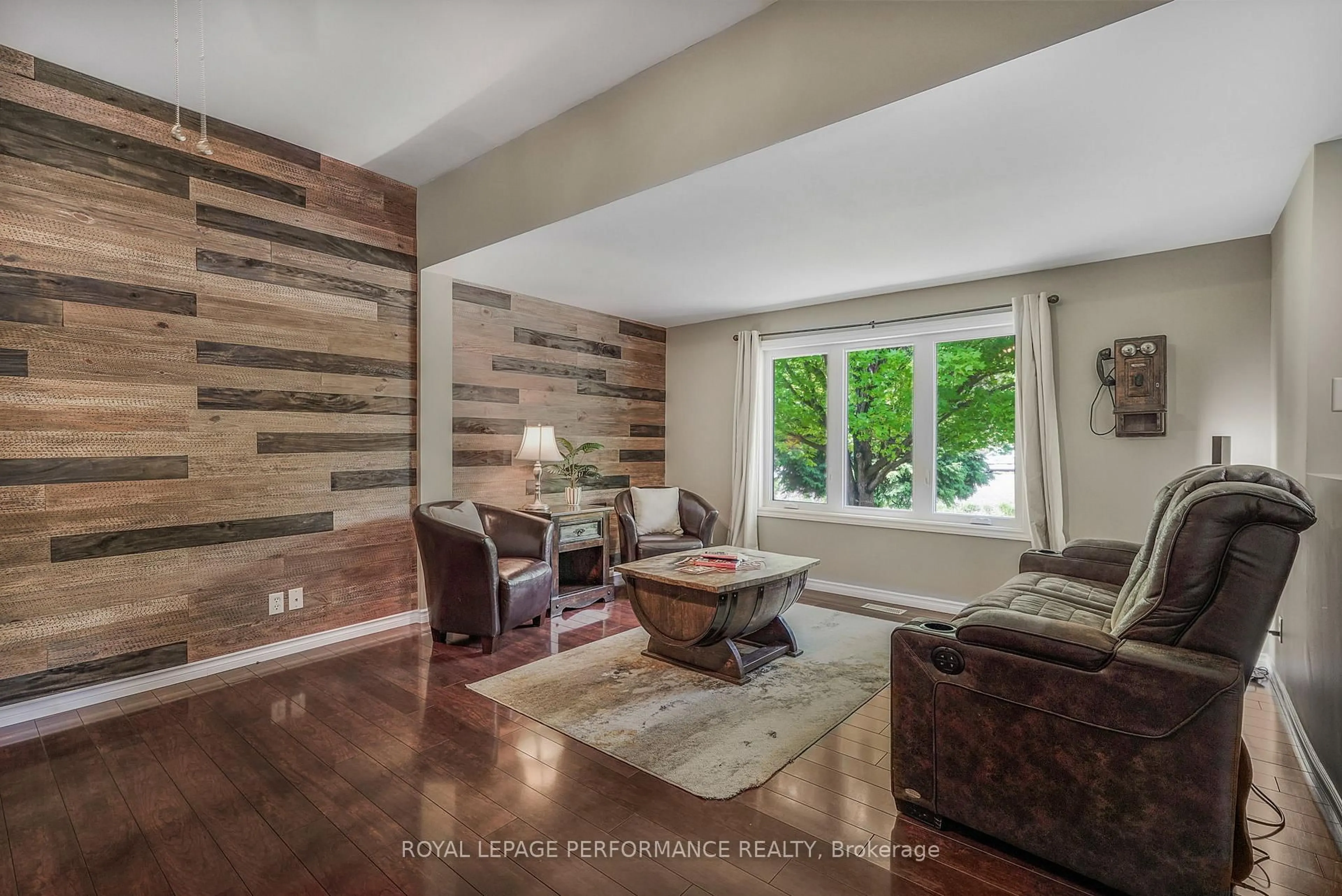 Living room with furniture, wood/laminate floor for 8872 Mitch Owens Rd, Ottawa Ontario K0A 1V0