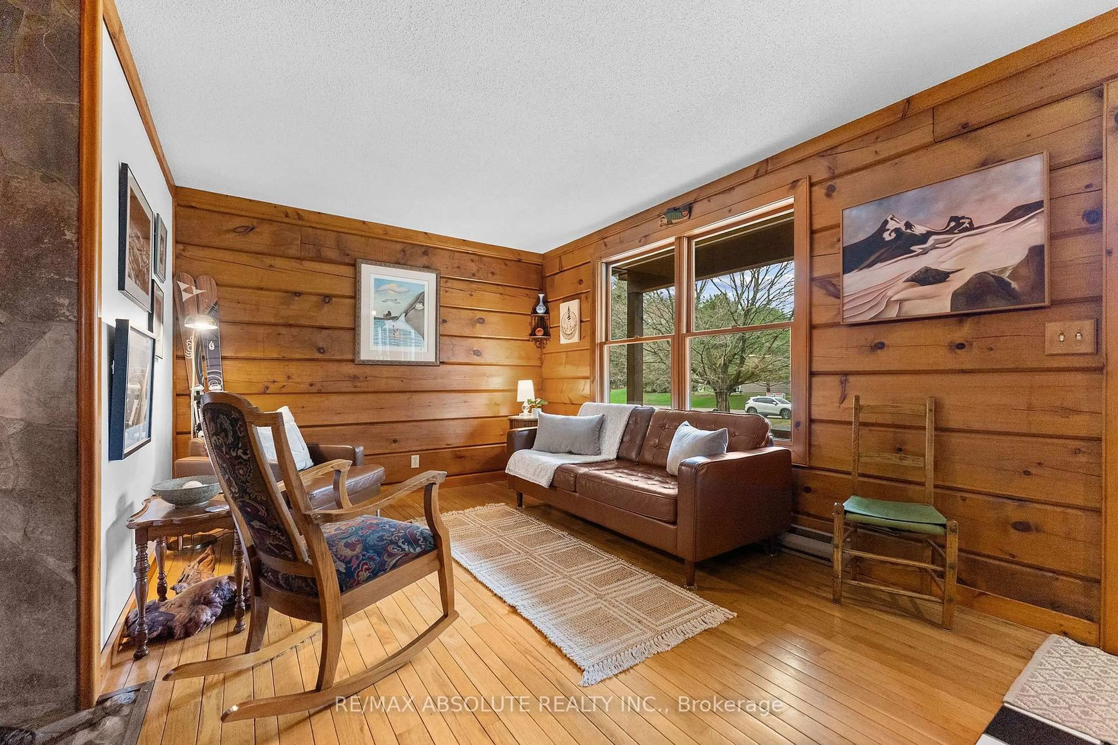 Living room with furniture, wood/laminate floor for 21 Forest Ridge Rd, Arnprior Ontario K7S 3T3