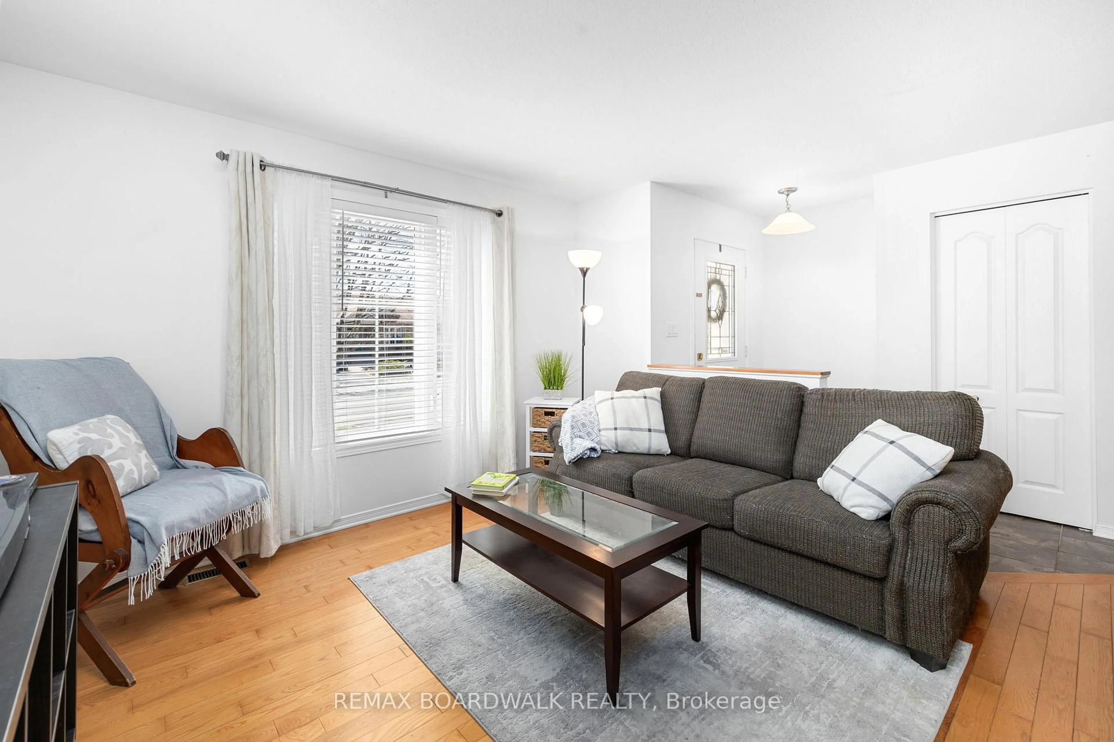 Living room with furniture, wood/laminate floor for 403 Flora St, Carleton Place Ontario K7C 4T6