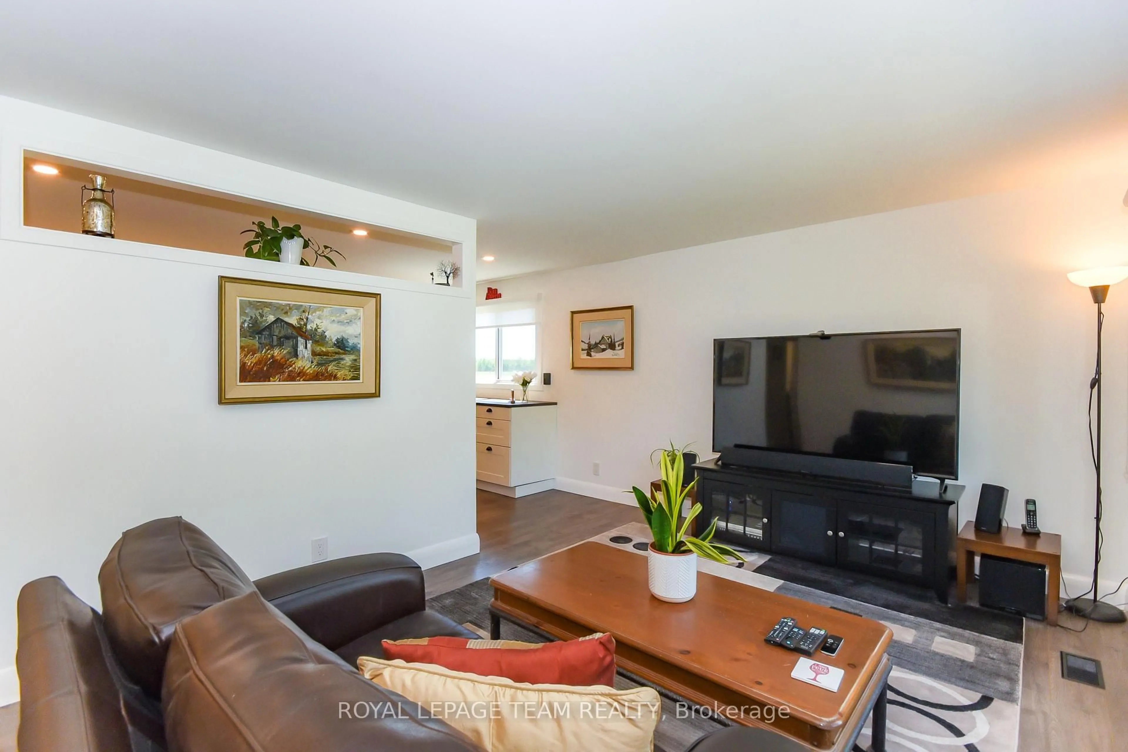 Living room with furniture, wood/laminate floor for 3599 Nixon Dr, Osgoode Ontario K0A 2W0