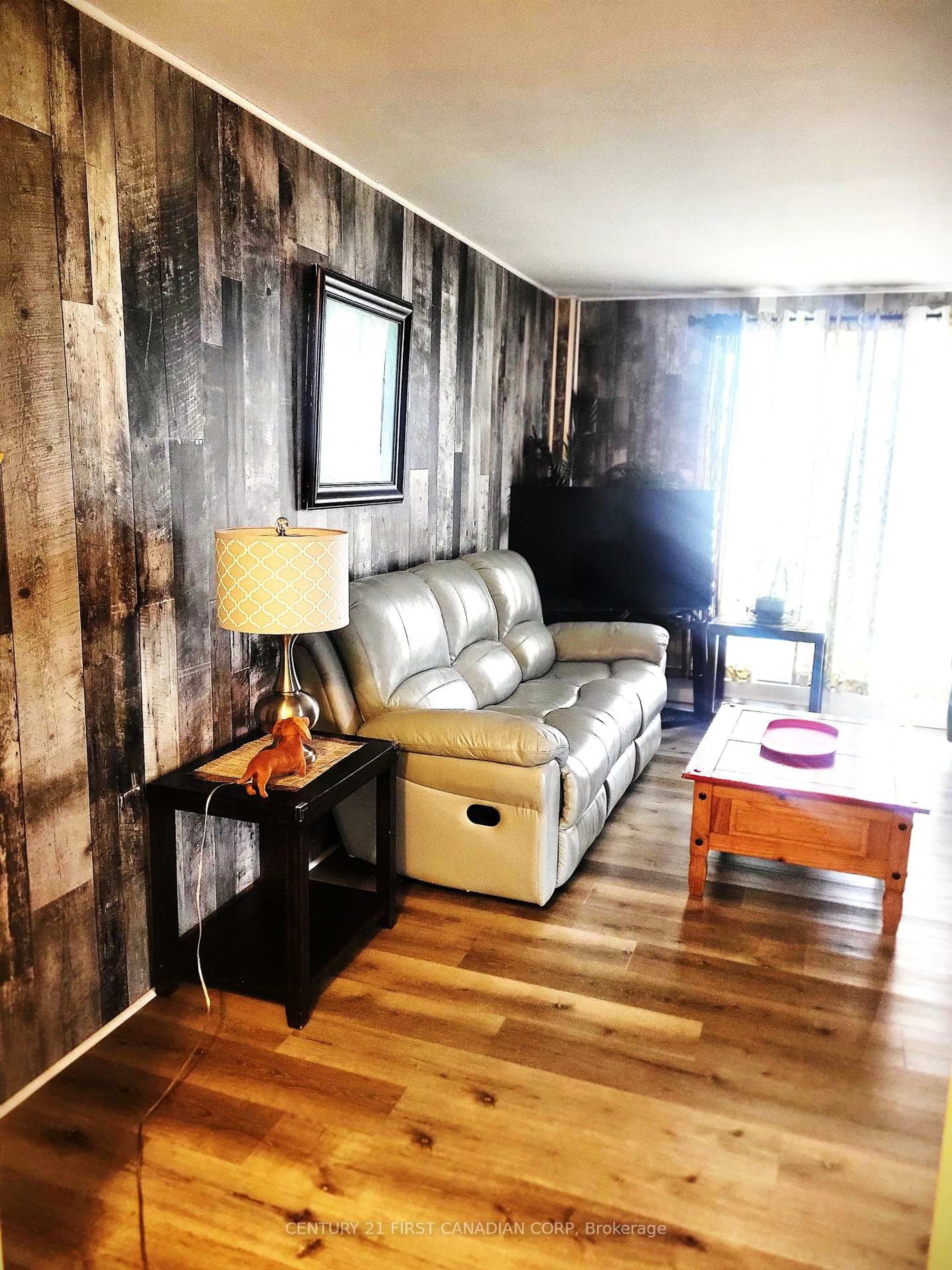 Living room with furniture, wood/laminate floor for 583 Mornington Ave #604, London East Ontario N5Y 3E9