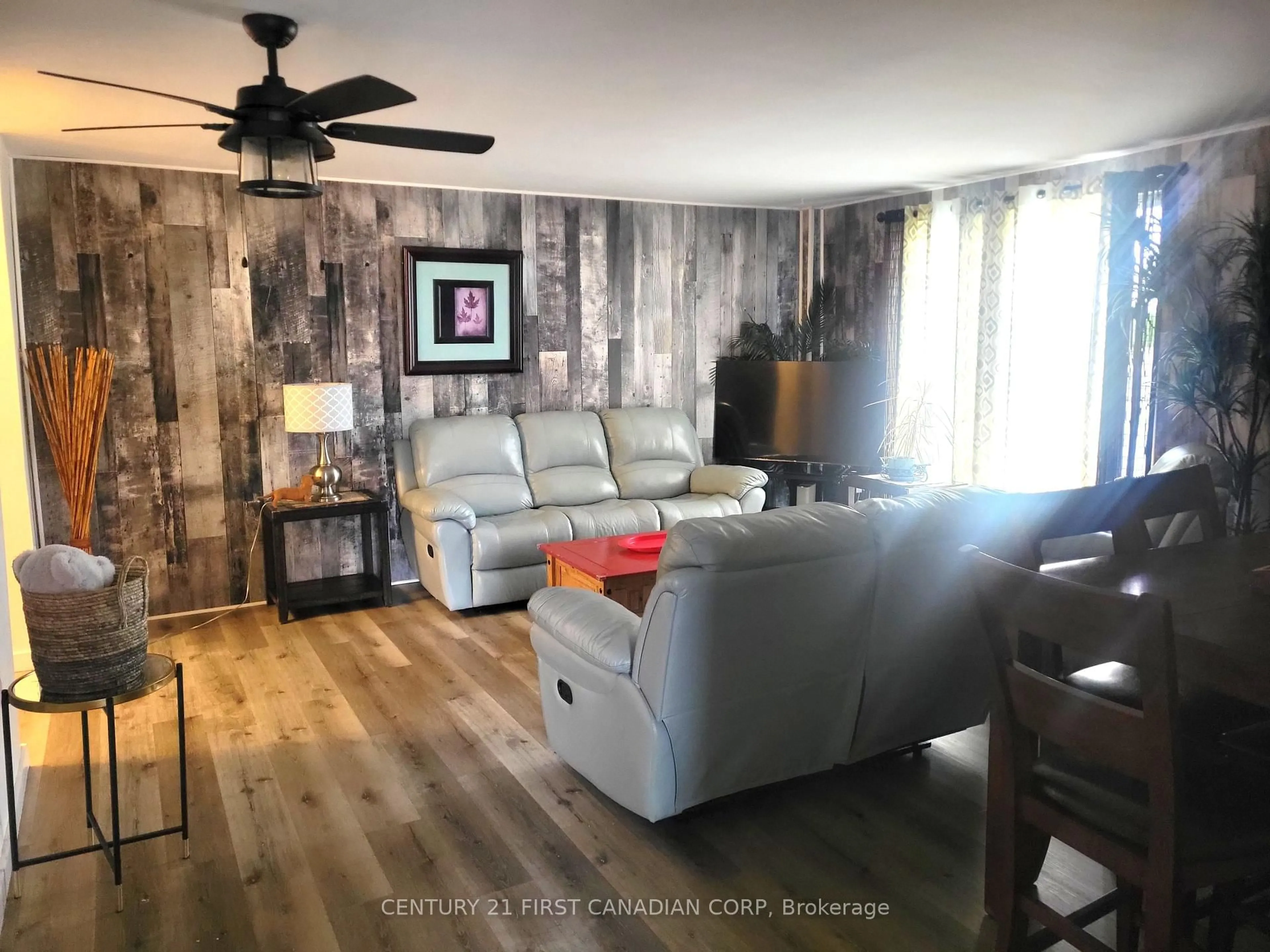 Living room with furniture, wood/laminate floor for 583 Mornington Ave #604, London East Ontario N5Y 3E9