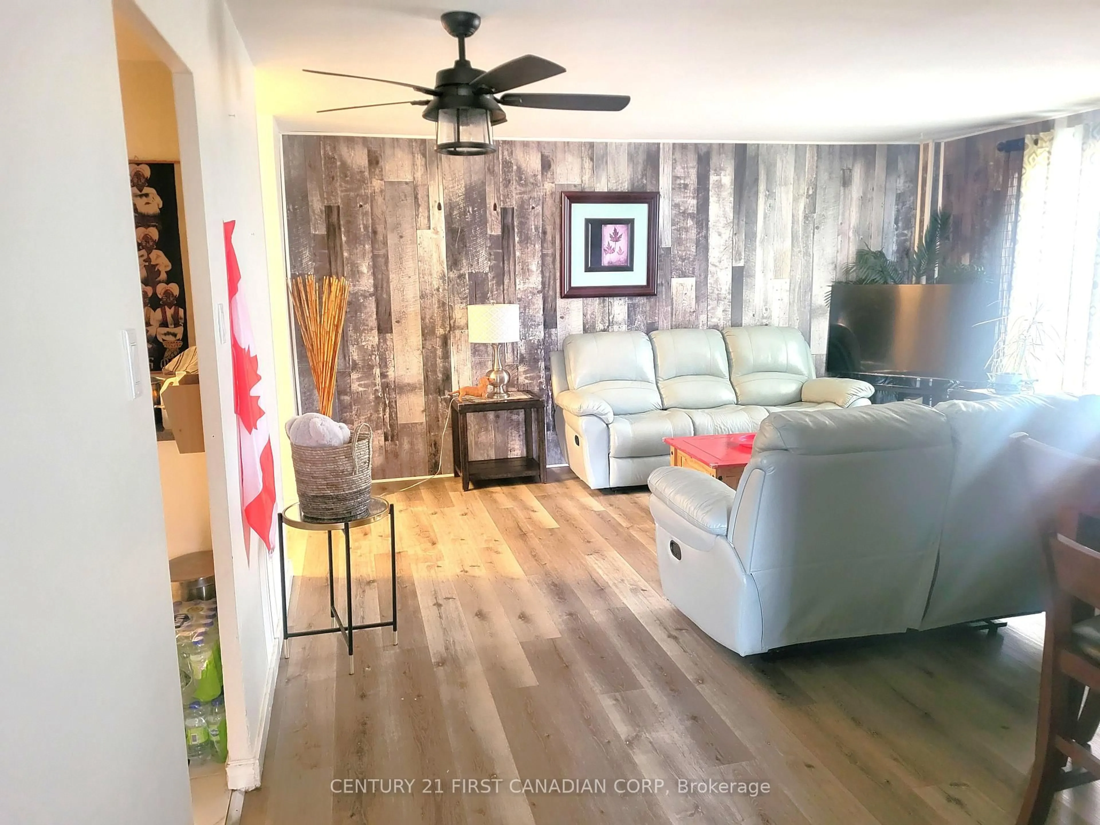 Living room with furniture, wood/laminate floor for 583 Mornington Ave #604, London East Ontario N5Y 3E9