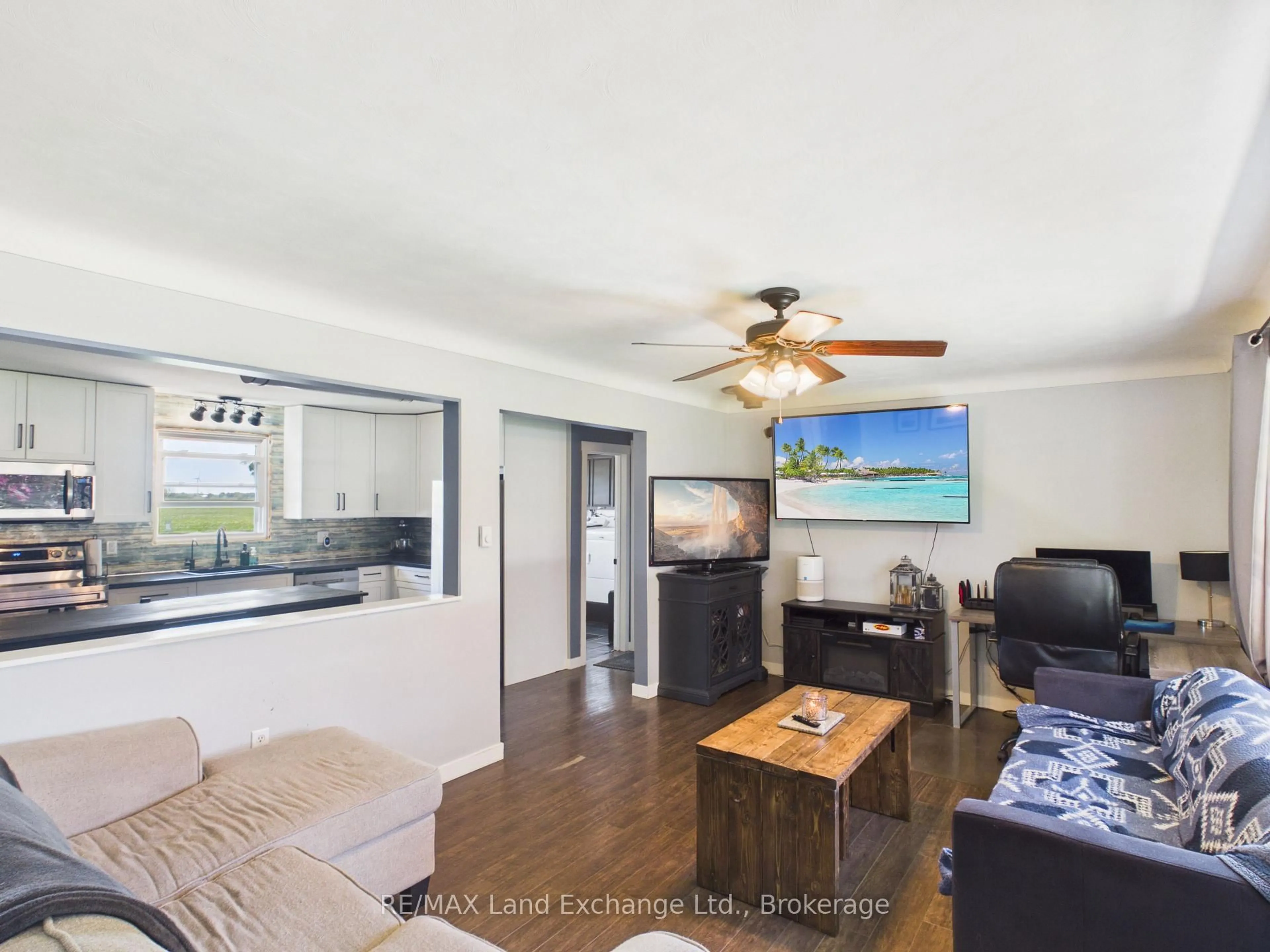 Living room with furniture, wood/laminate floor for 84700 Kingsbridge Line, Ashfield-Colborne-Wawanosh Ontario N7A 3X9