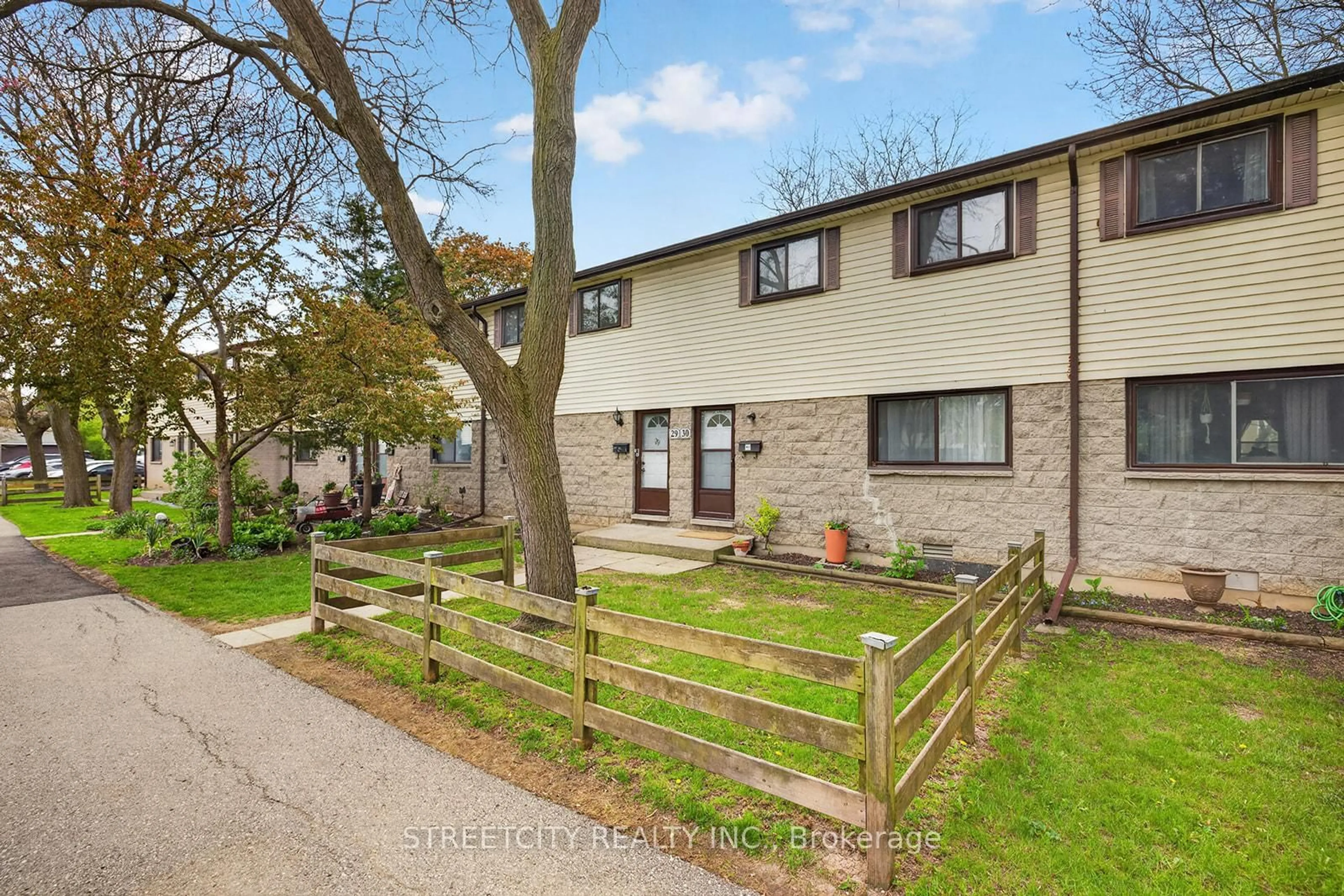 A pic from outside/outdoor area/front of a property/back of a property/a pic from drone, street for 825 Dundalk Dr #30, London South Ontario N6C 3V6