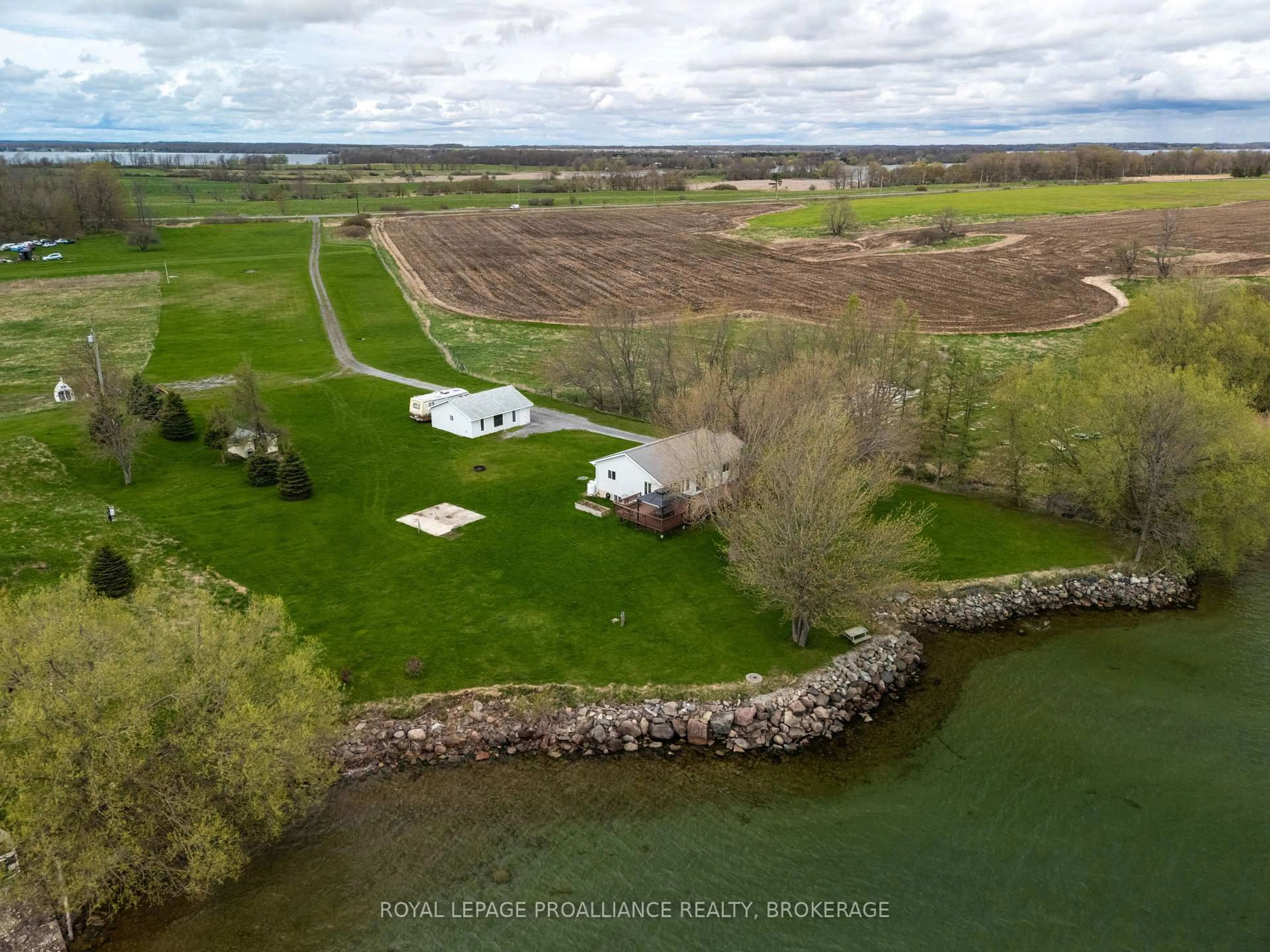 A pic from outside/outdoor area/front of a property/back of a property/a pic from drone, water/lake/river/ocean view for 4205 Highway 96, Wolfe Island Ontario K0H 2Y0