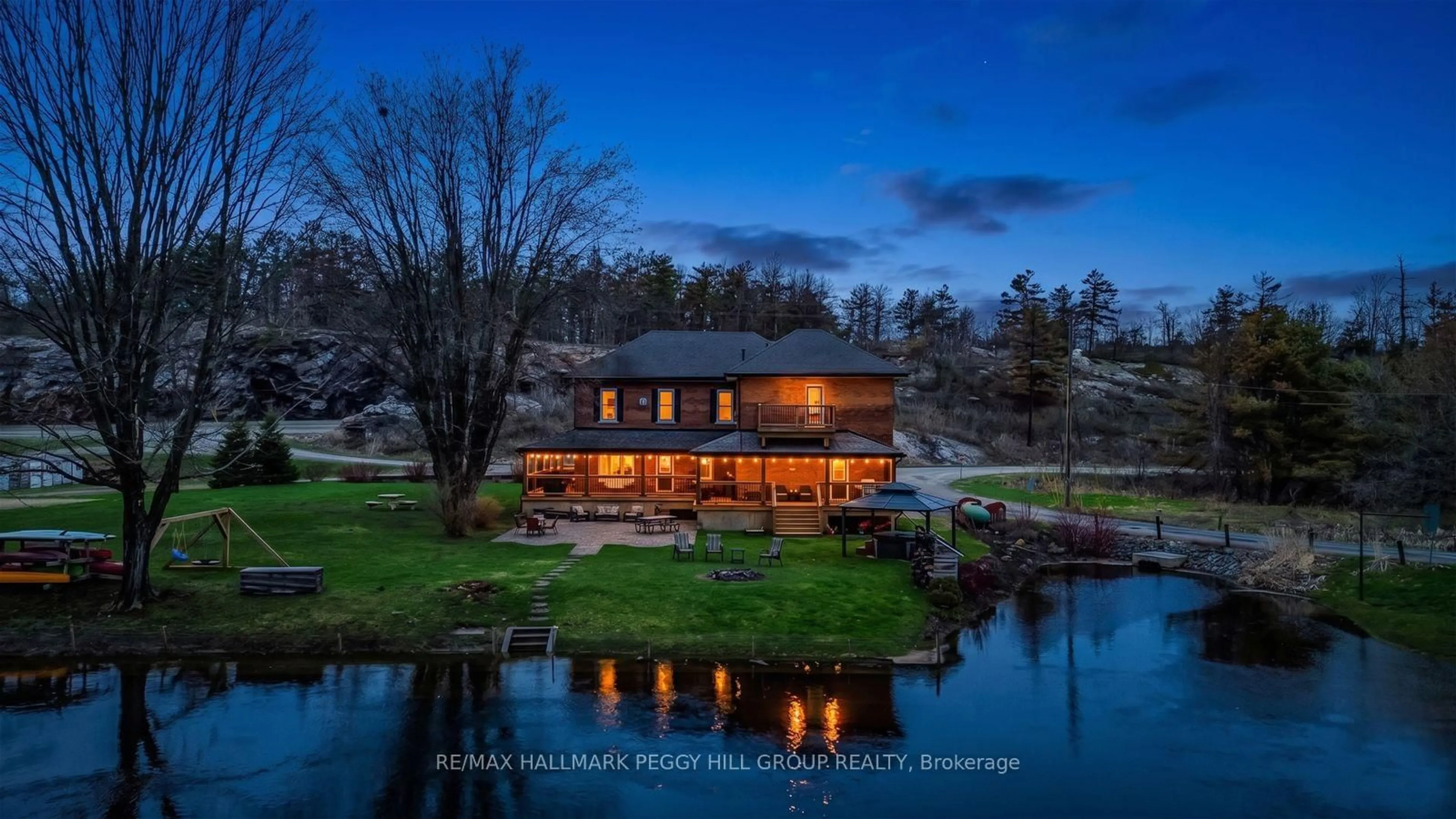 A pic from outside/outdoor area/front of a property/back of a property/a pic from drone, water/lake/river/ocean view for 1002 Cowbell Lane, Gravenhurst Ontario P0E 1N0
